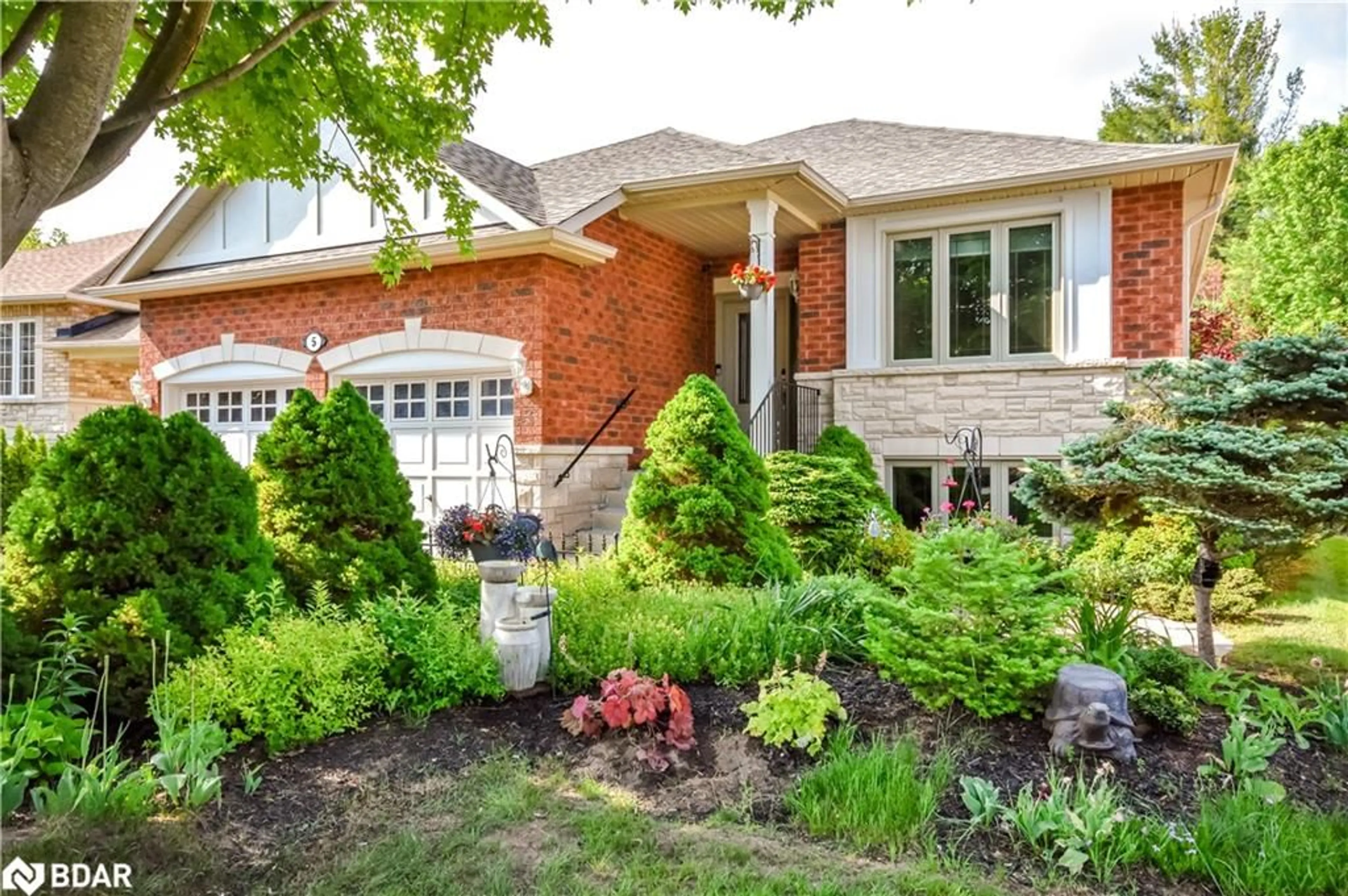 Home with brick exterior material, street for 5 Meadowood Dr, Wasaga Beach Ontario L9Z 3C2