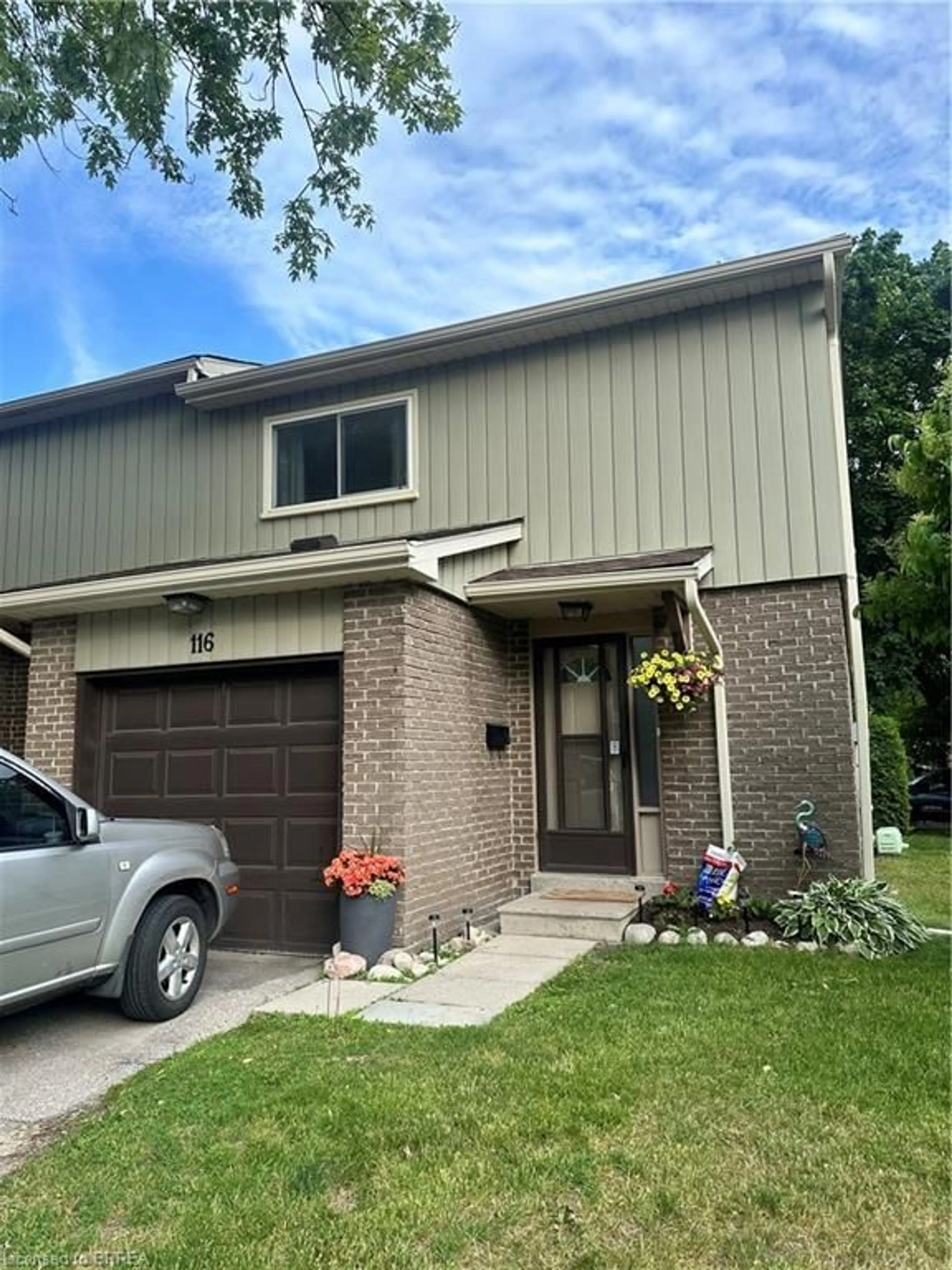 Home with brick exterior material, street for 51 Paulander Dr #116, Kitchener Ontario N2M 5E5