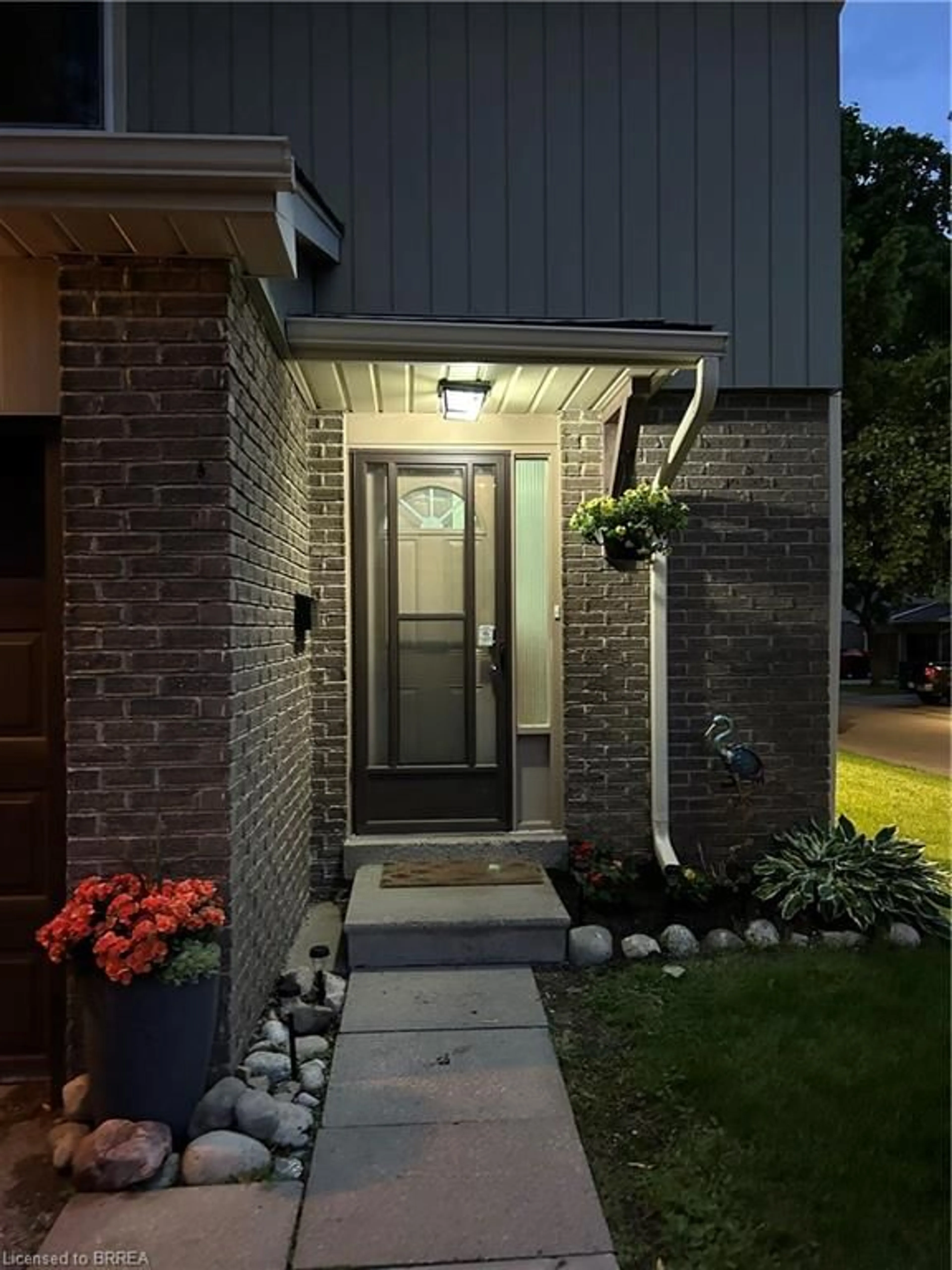 Home with brick exterior material, street for 51 Paulander Dr #116, Kitchener Ontario N2M 5E5