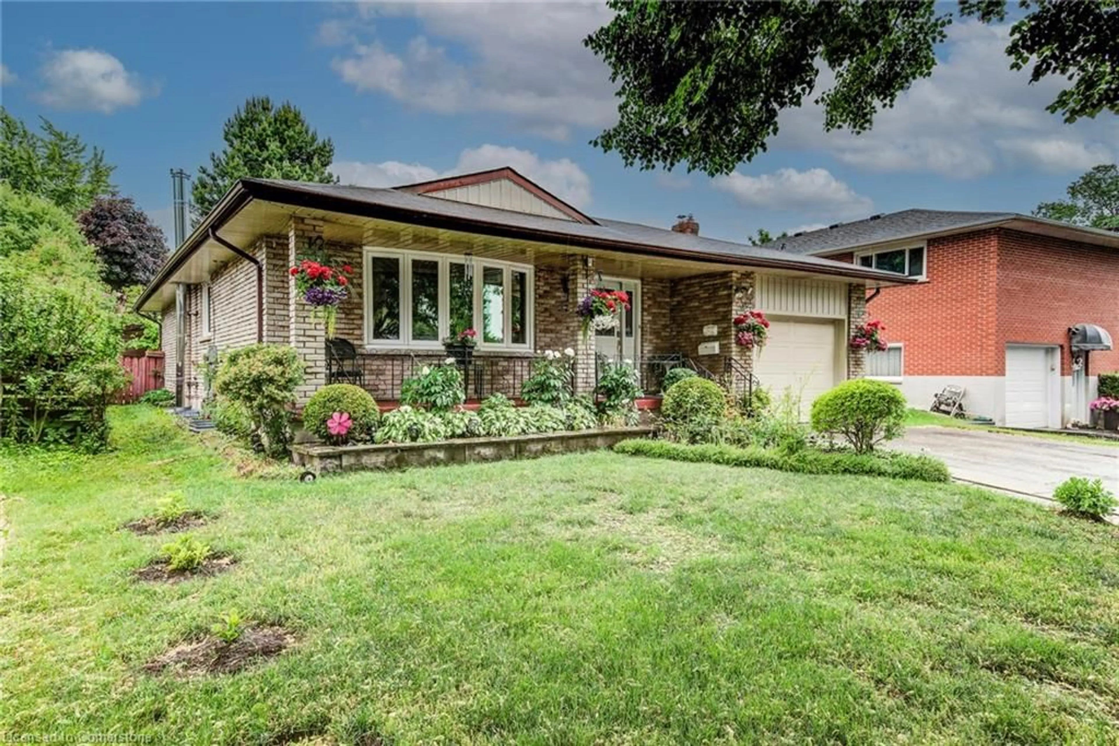 Home with brick exterior material, street for 170 Martinglen Cres, Kitchener Ontario N2E 2A2