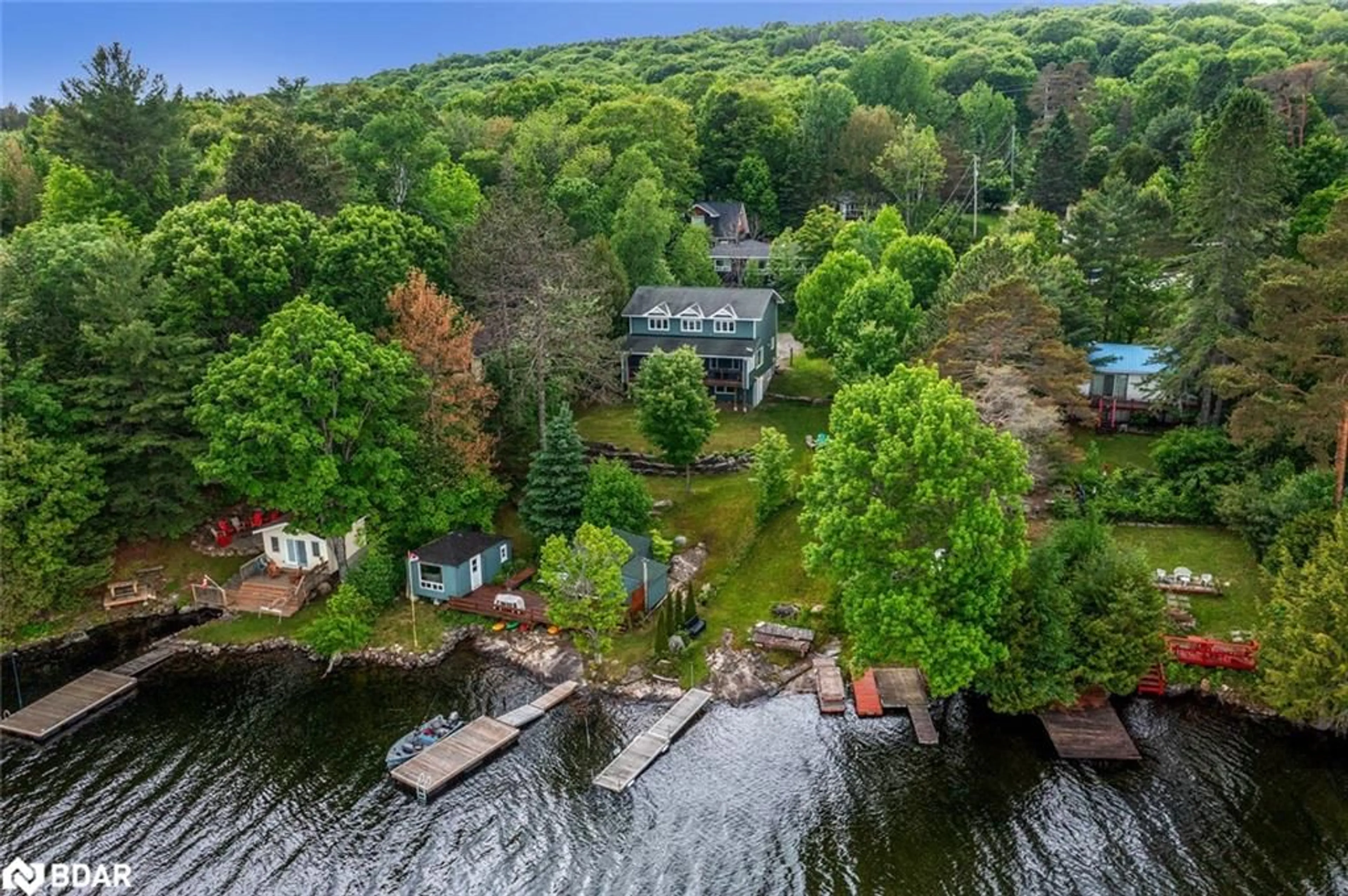 A pic from outside/outdoor area/front of a property/back of a property/a pic from drone, water/lake/river/ocean view for 1033 Harvest Moon Lane, Algonquin Highlands Ontario K0M 1S0