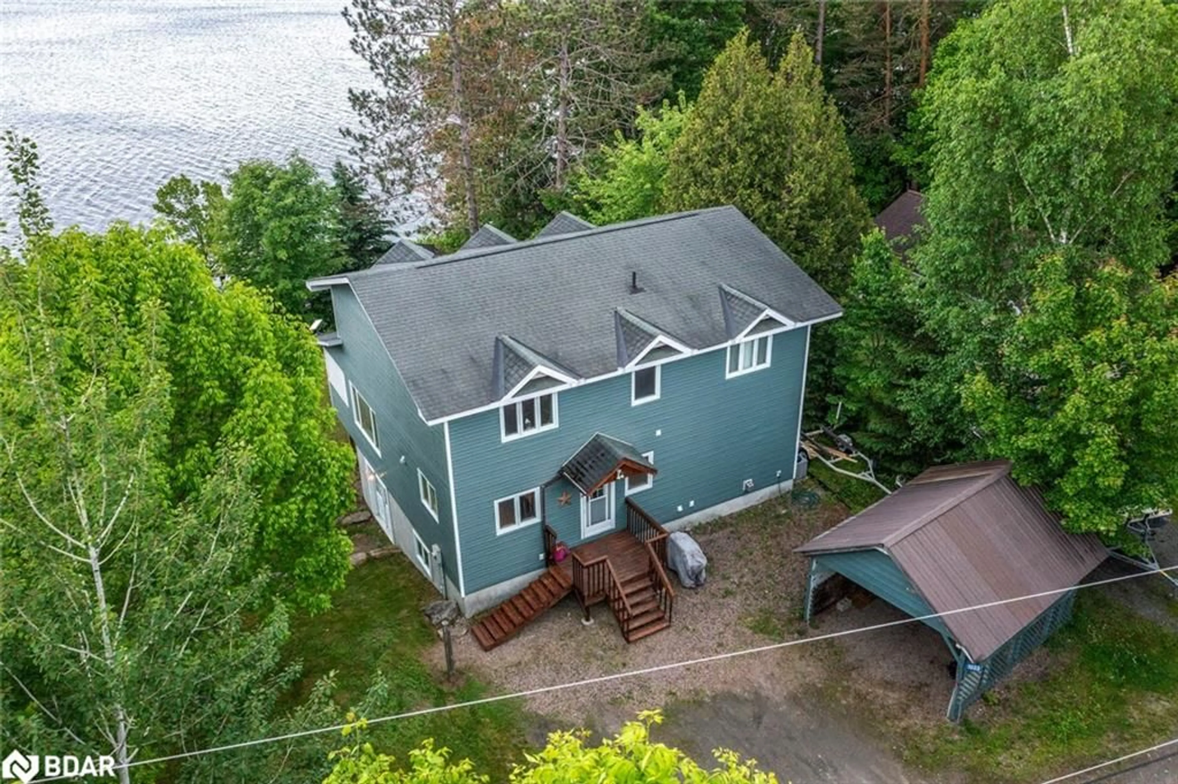 A pic from outside/outdoor area/front of a property/back of a property/a pic from drone, water/lake/river/ocean view for 1033 Harvest Moon Lane, Algonquin Highlands Ontario K0M 1S0