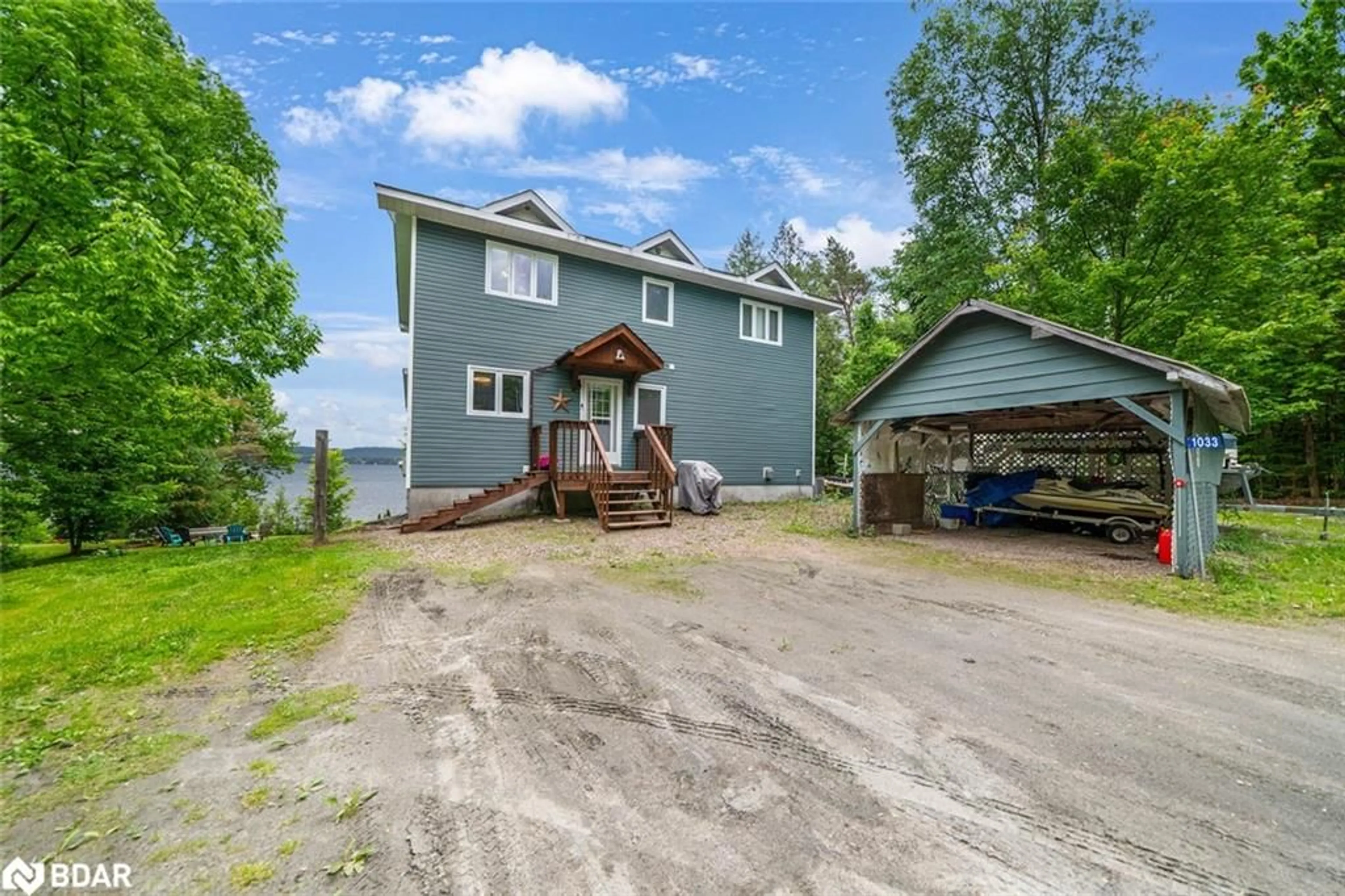 A pic from outside/outdoor area/front of a property/back of a property/a pic from drone, water/lake/river/ocean view for 1033 Harvest Moon Lane, Algonquin Highlands Ontario K0M 1S0