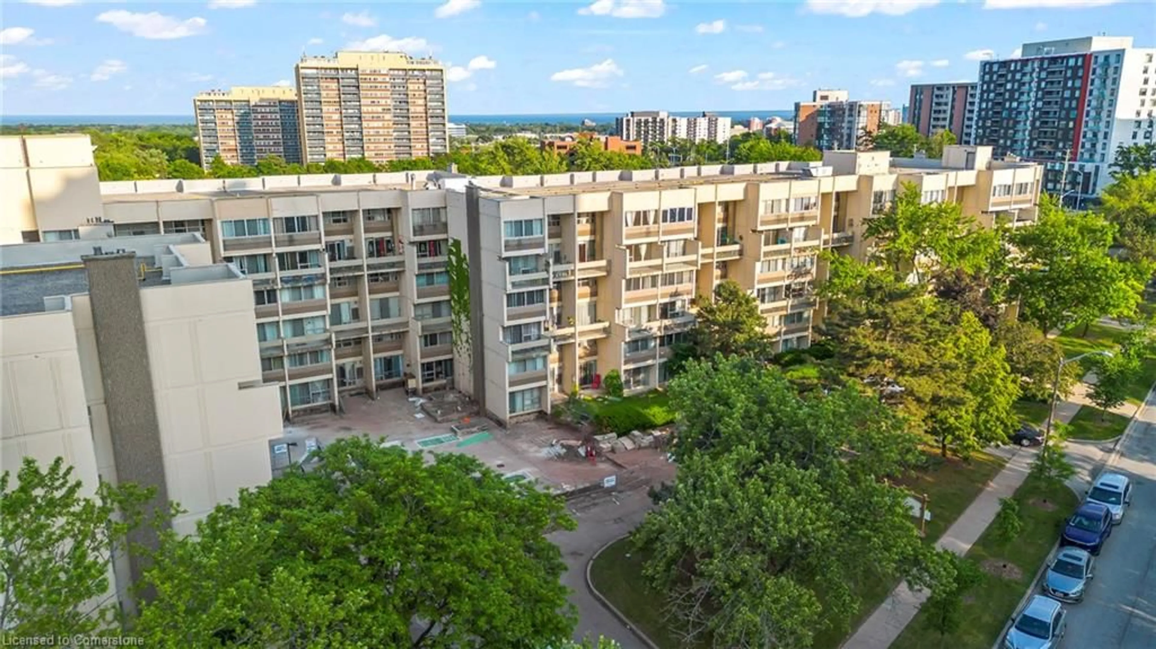 A pic from outside/outdoor area/front of a property/back of a property/a pic from drone, city buildings view from balcony for 1300 Marlborough Crt #523, Oakville Ontario L6H 2S2