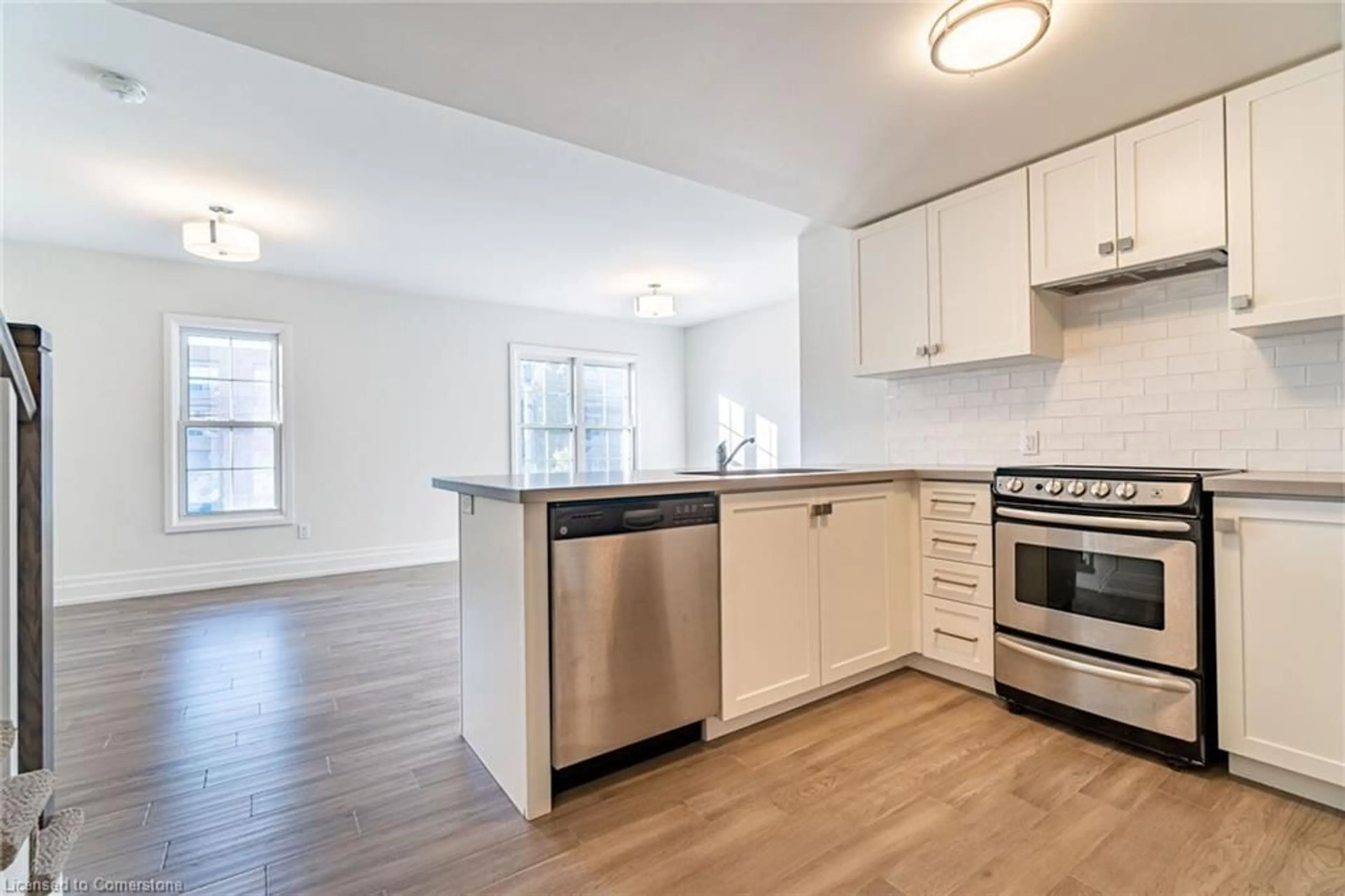 Open concept kitchen, wood/laminate floor for 760 Lakeshore Rd #202, Mississauga Ontario L5E 1C7