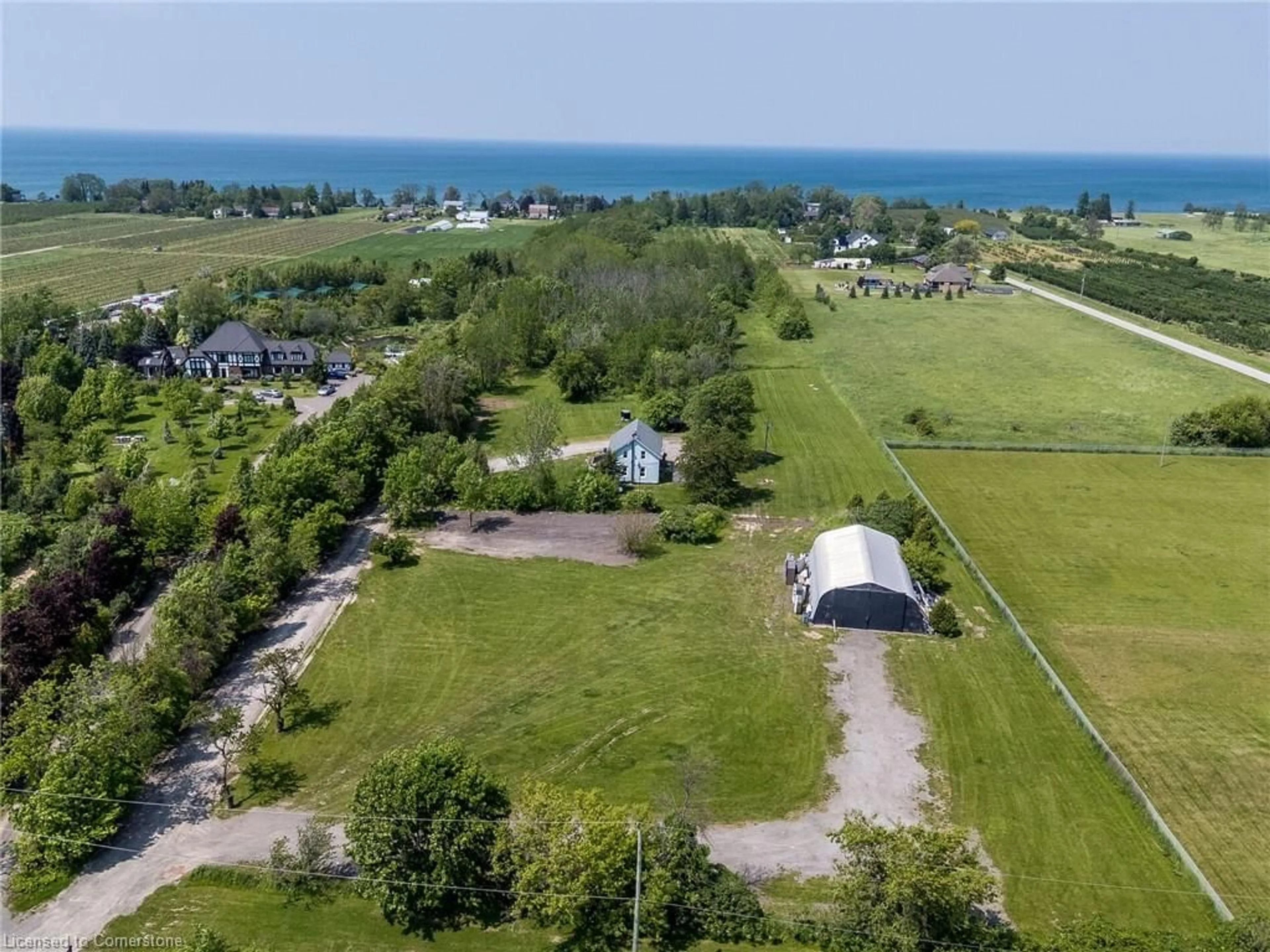 A pic from outside/outdoor area/front of a property/back of a property/a pic from drone, water/lake/river/ocean view for 4613 North Service Rd, Beamsville Ontario L0R 1B1