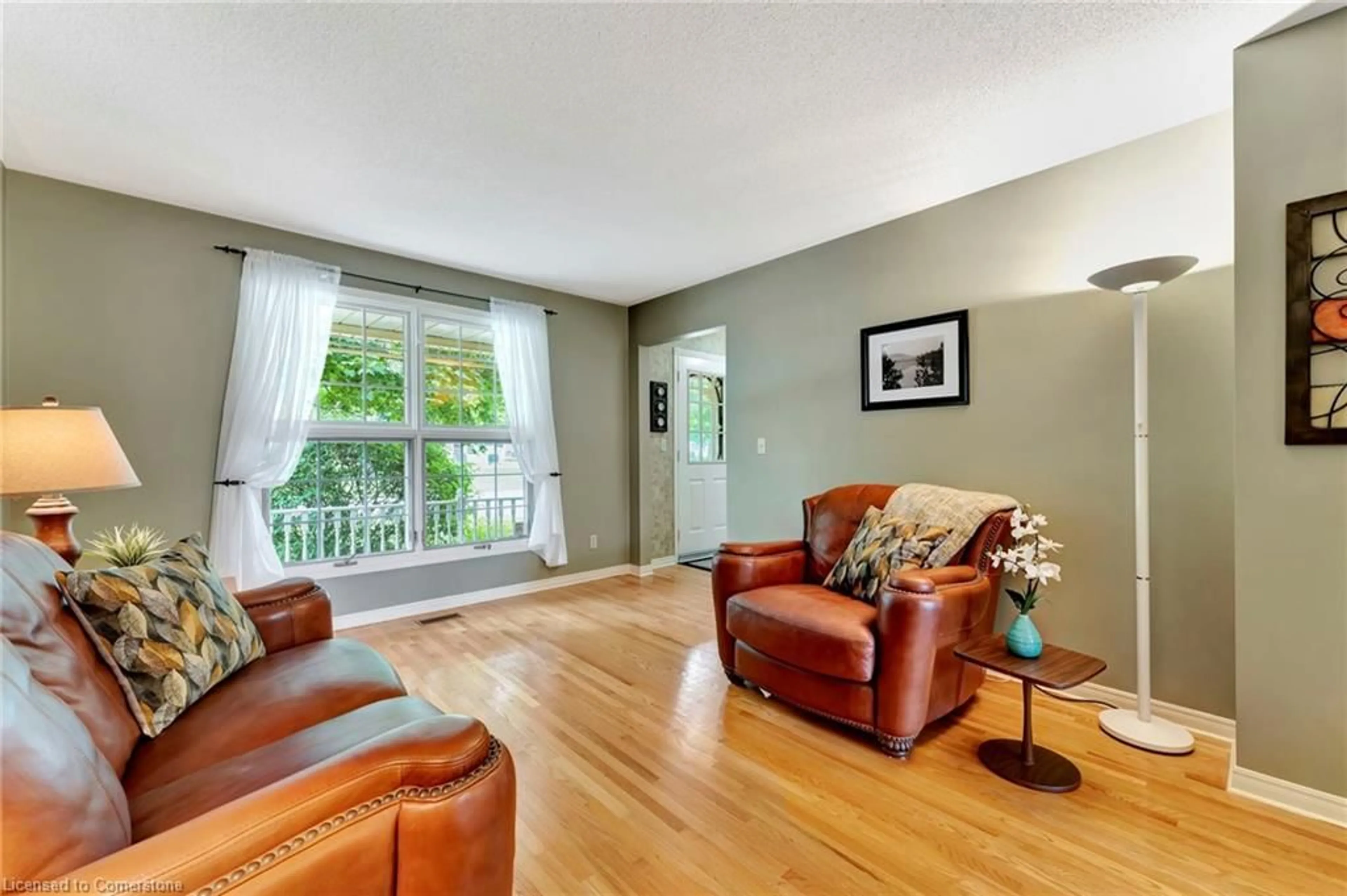Living room with furniture, wood/laminate floor for 920 Walton Ave, Listowel Ontario N4W 3R9