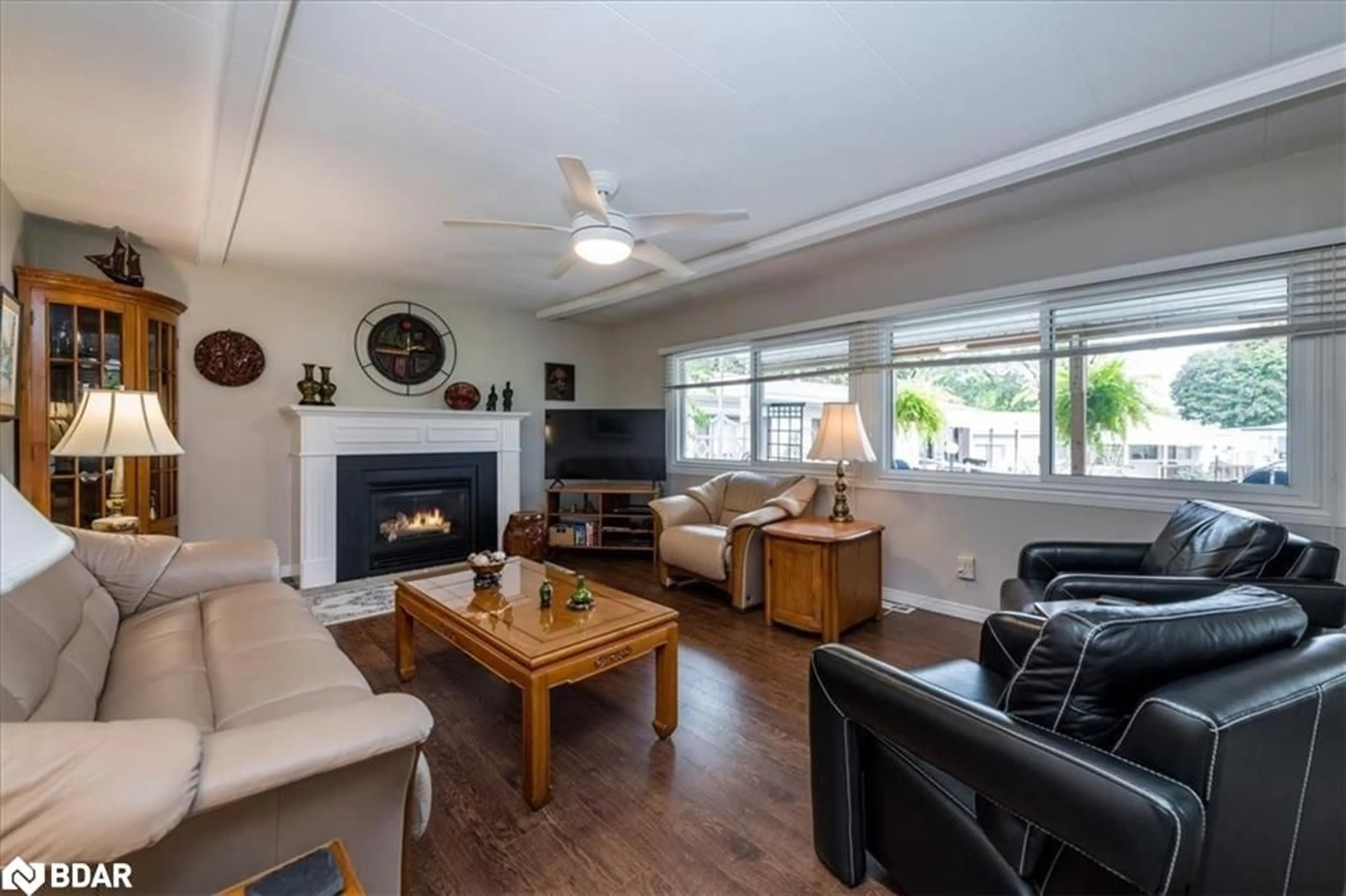 Living room with furniture, wood/laminate floor for 2 Cedar Grove, Innisfil Ontario L9S 1R1