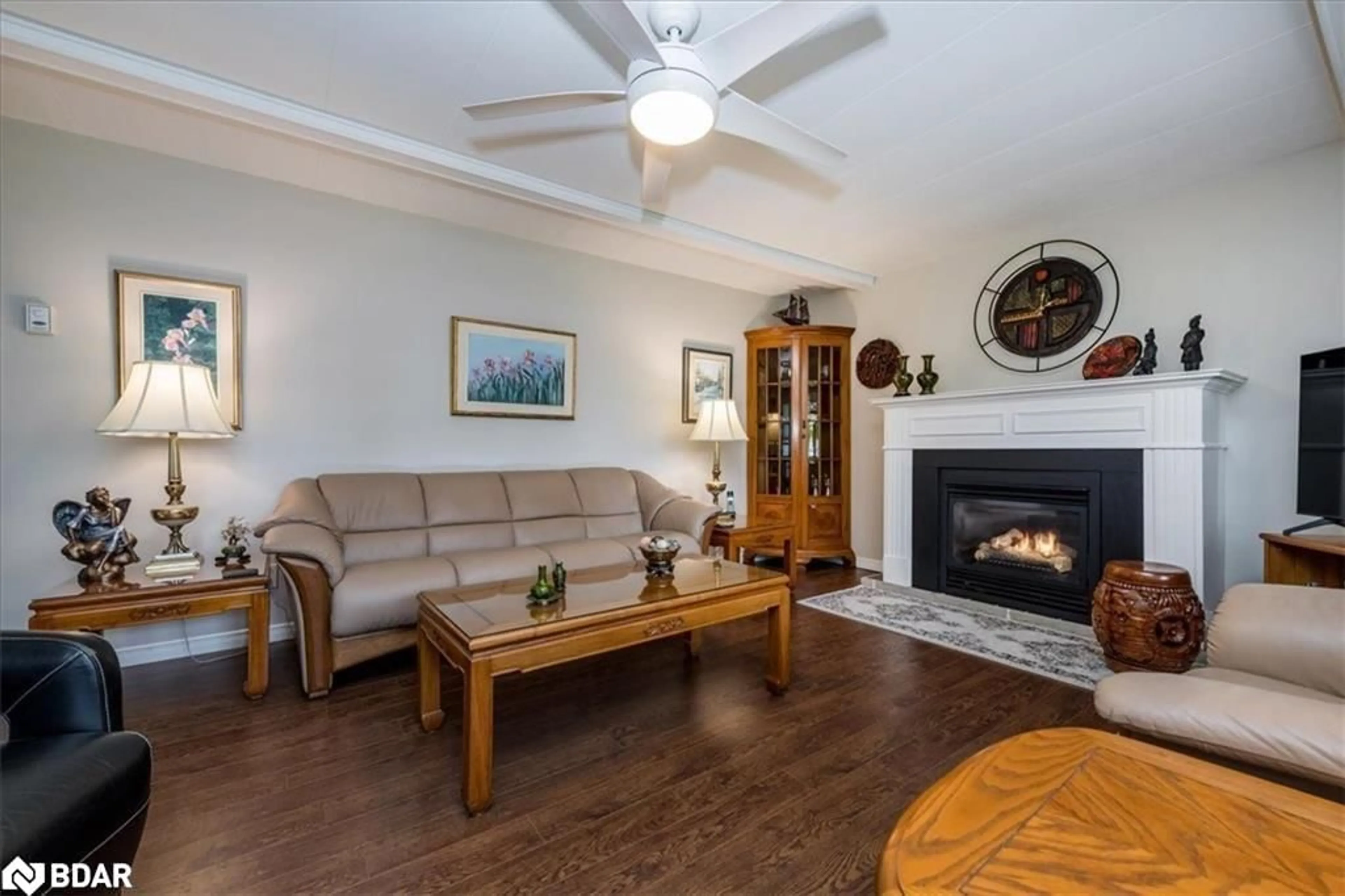 Living room with furniture, wood/laminate floor for 2 Cedar Grove, Innisfil Ontario L9S 1R1