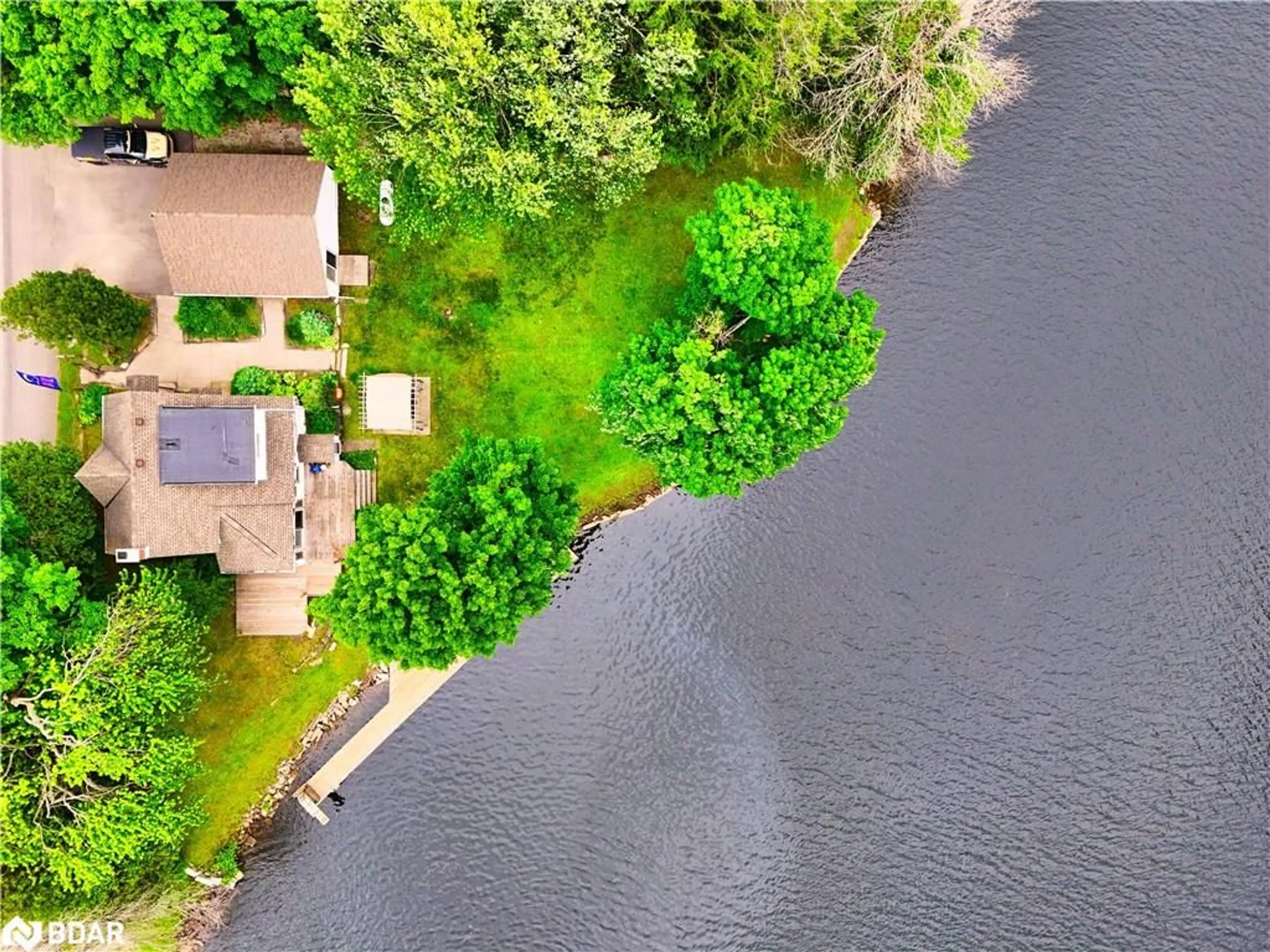 A pic from outside/outdoor area/front of a property/back of a property/a pic from drone, water/lake/river/ocean view for 1012 Cowbell Lane, Severn Bridge Ontario P0E 1N0