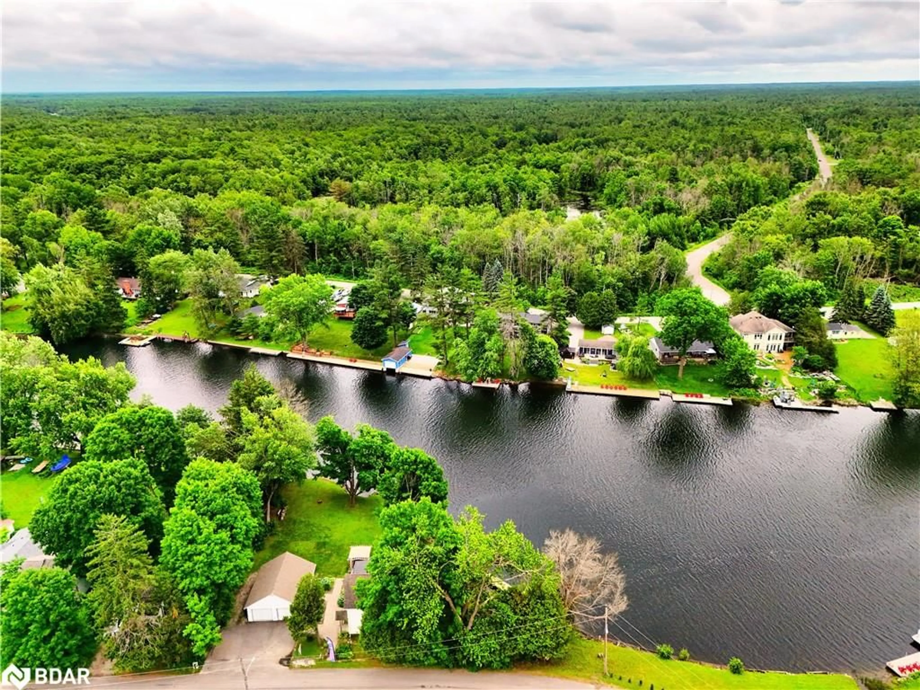 A pic from outside/outdoor area/front of a property/back of a property/a pic from drone, water/lake/river/ocean view for 1012 Cowbell Lane, Severn Bridge Ontario P0E 1N0
