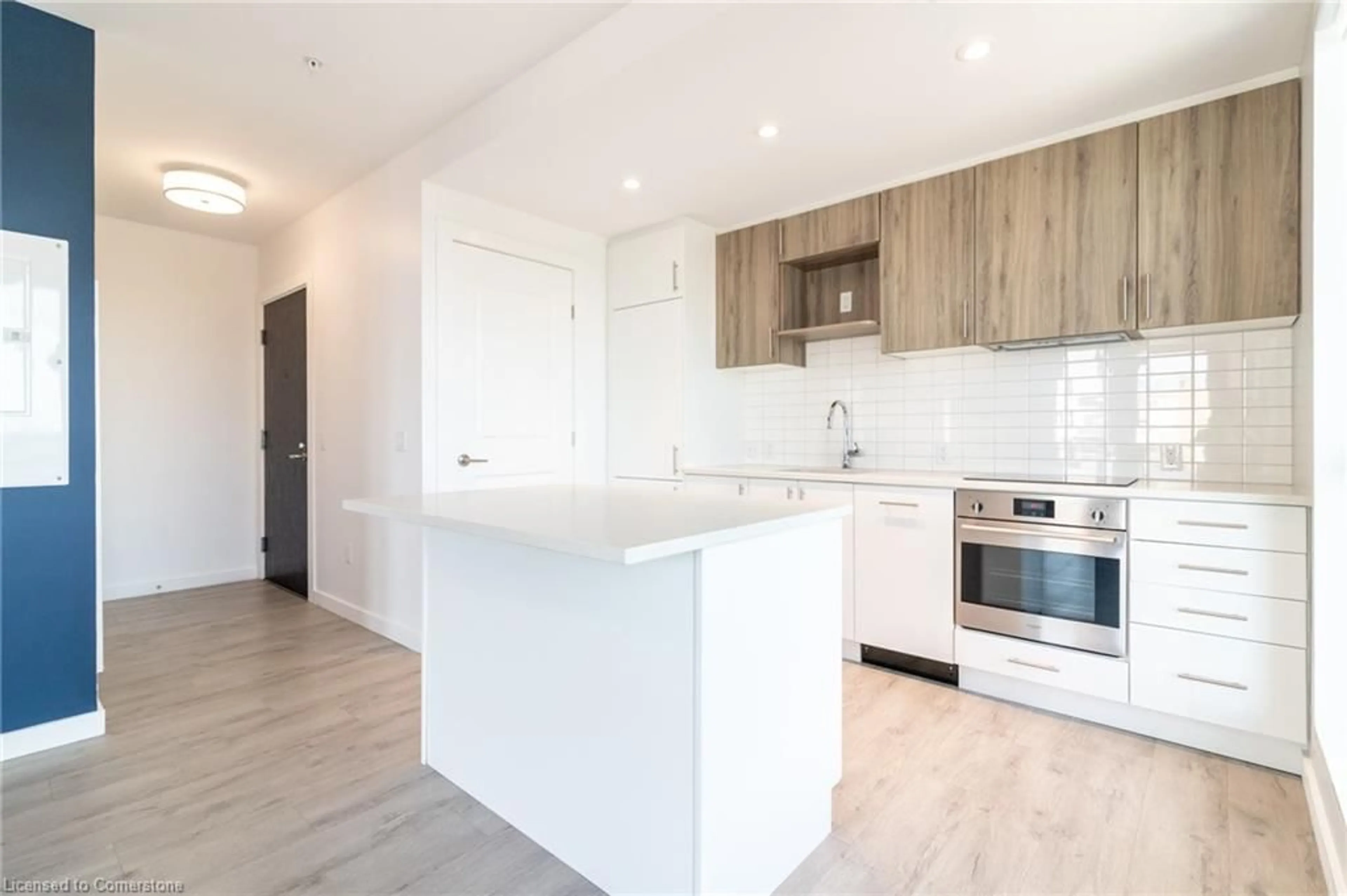Open concept kitchen, wood/laminate floor for 181 King St #1414, Waterloo Ontario N2J 0E7