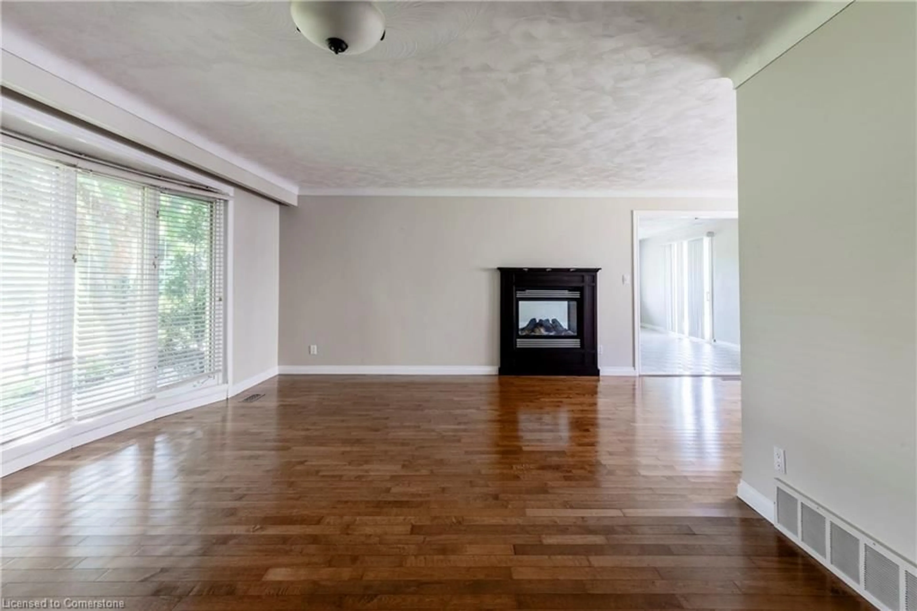 Living room with furniture, wood/laminate floor for 4245 Cedar Springs Rd, Burlington Ontario L7R 3X4