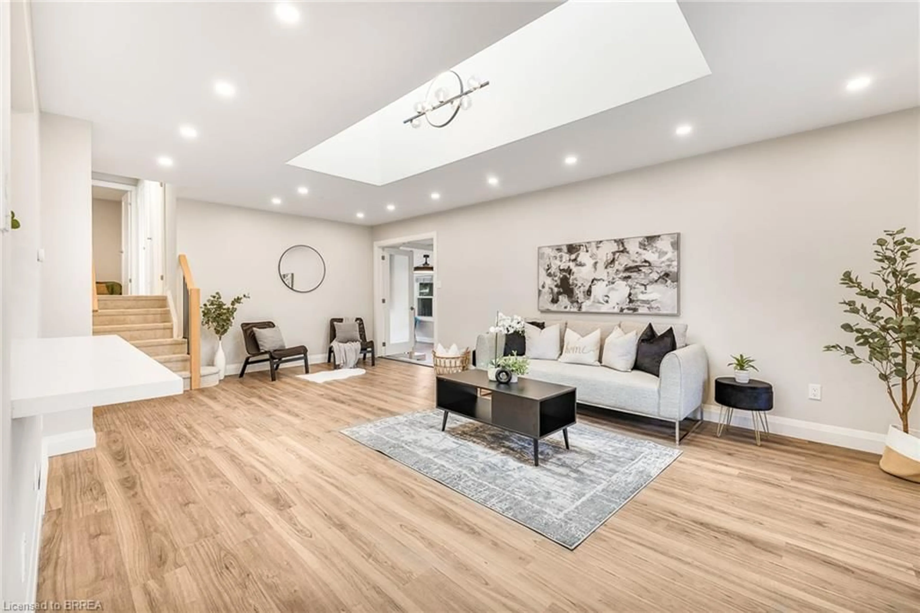 Living room with furniture, wood/laminate floor for 94 Appleford Rd, Hamilton Ontario L9C 6B8