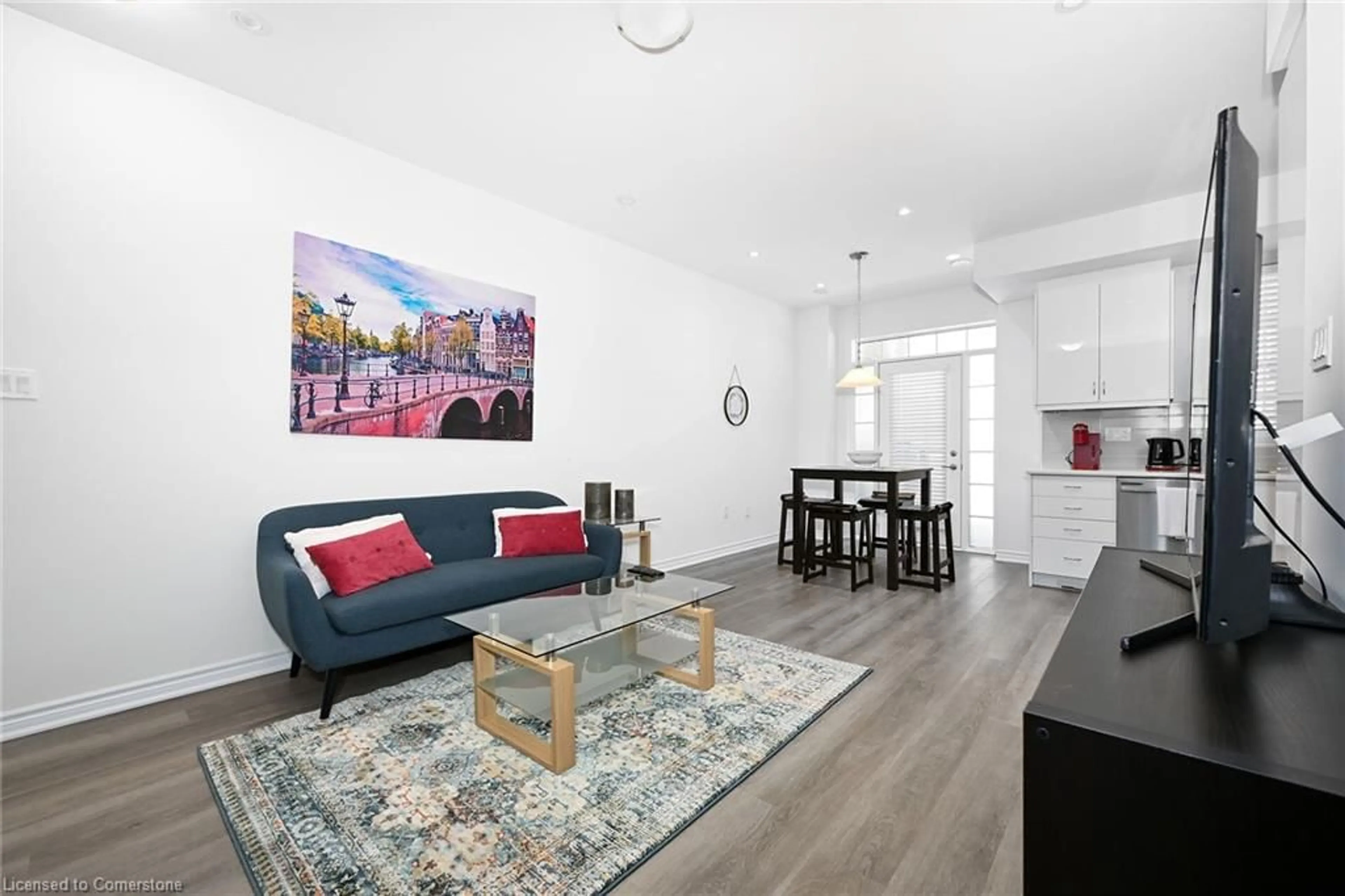 Living room with furniture, wood/laminate floor for 305 Garner Rd #17, Ancaster Ontario L9G 0H5