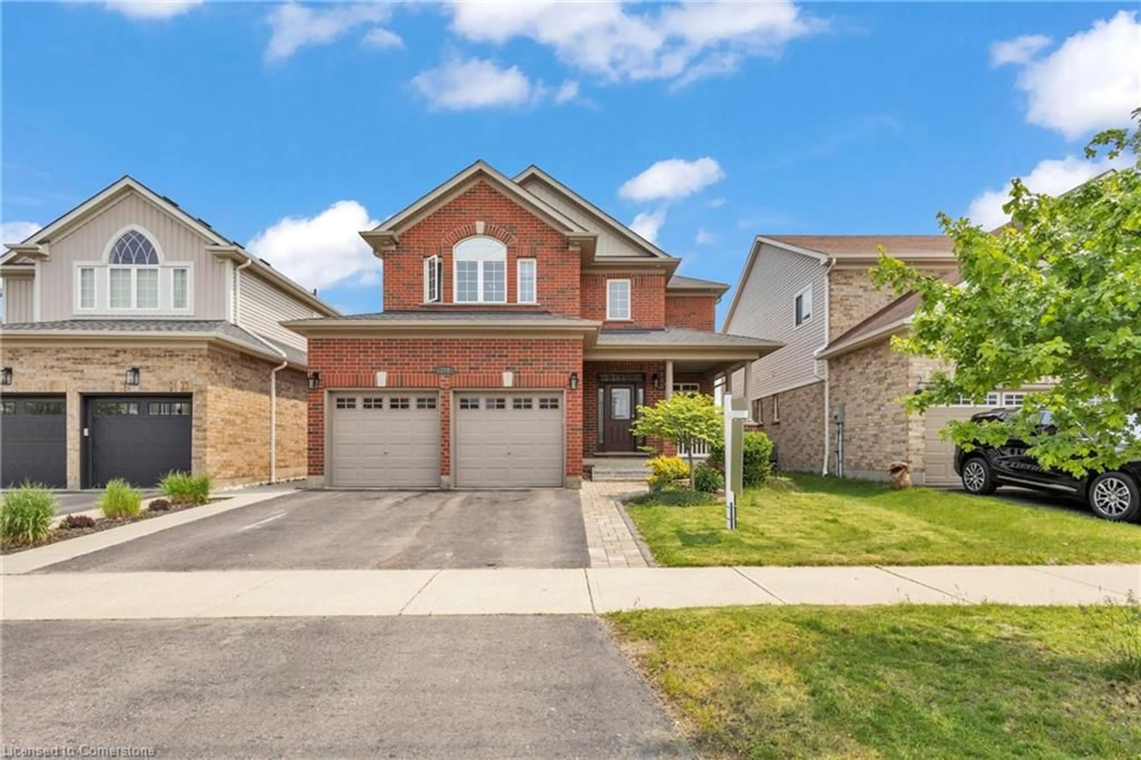Home with brick exterior material, street for 319 Robert Ferrie Dr, Kitchener Ontario N2P 2Y7