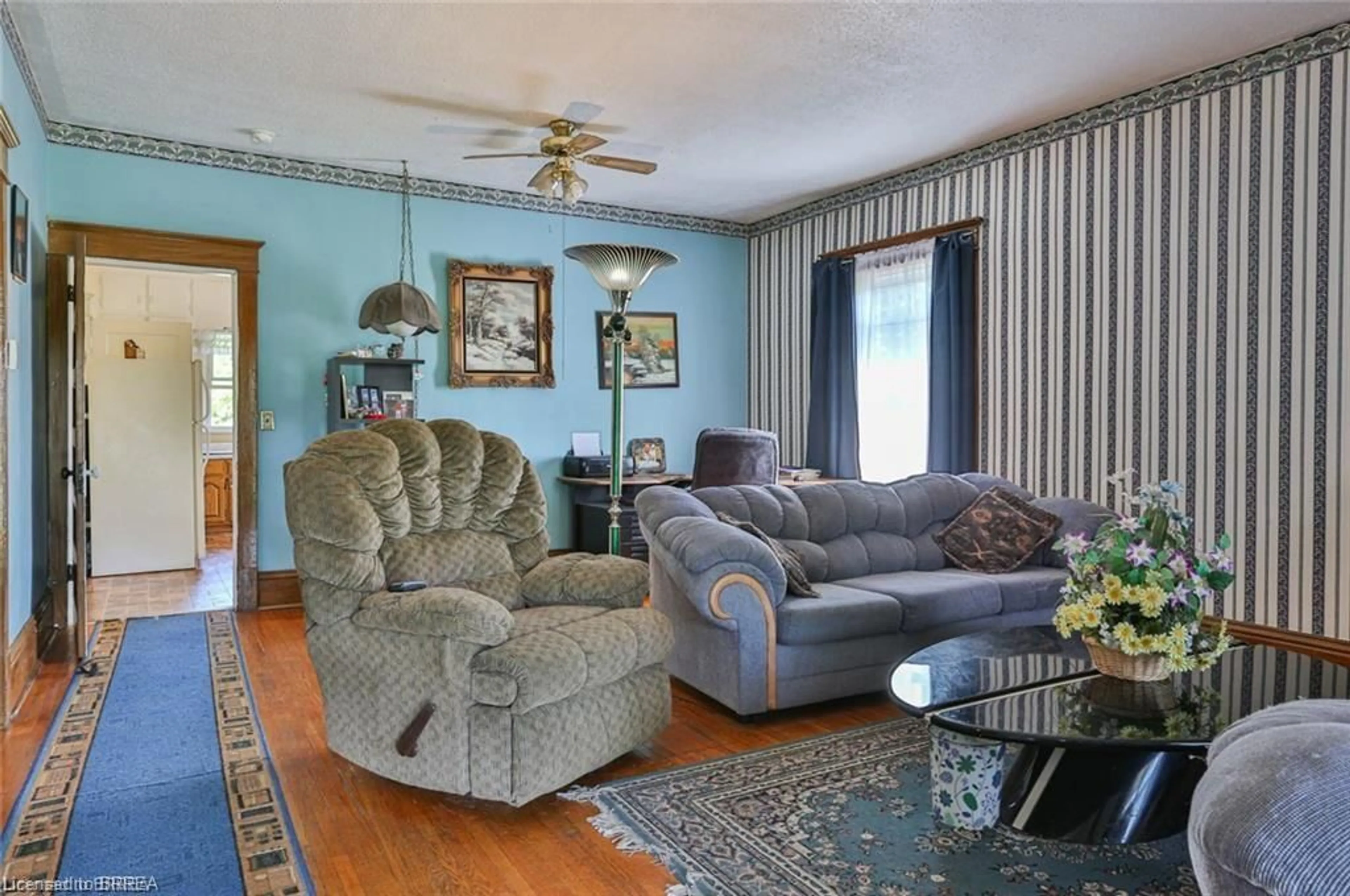 Living room with furniture, wood/laminate floor for 5 Cloverdale Ave, Brantford Ontario N3R 3X7