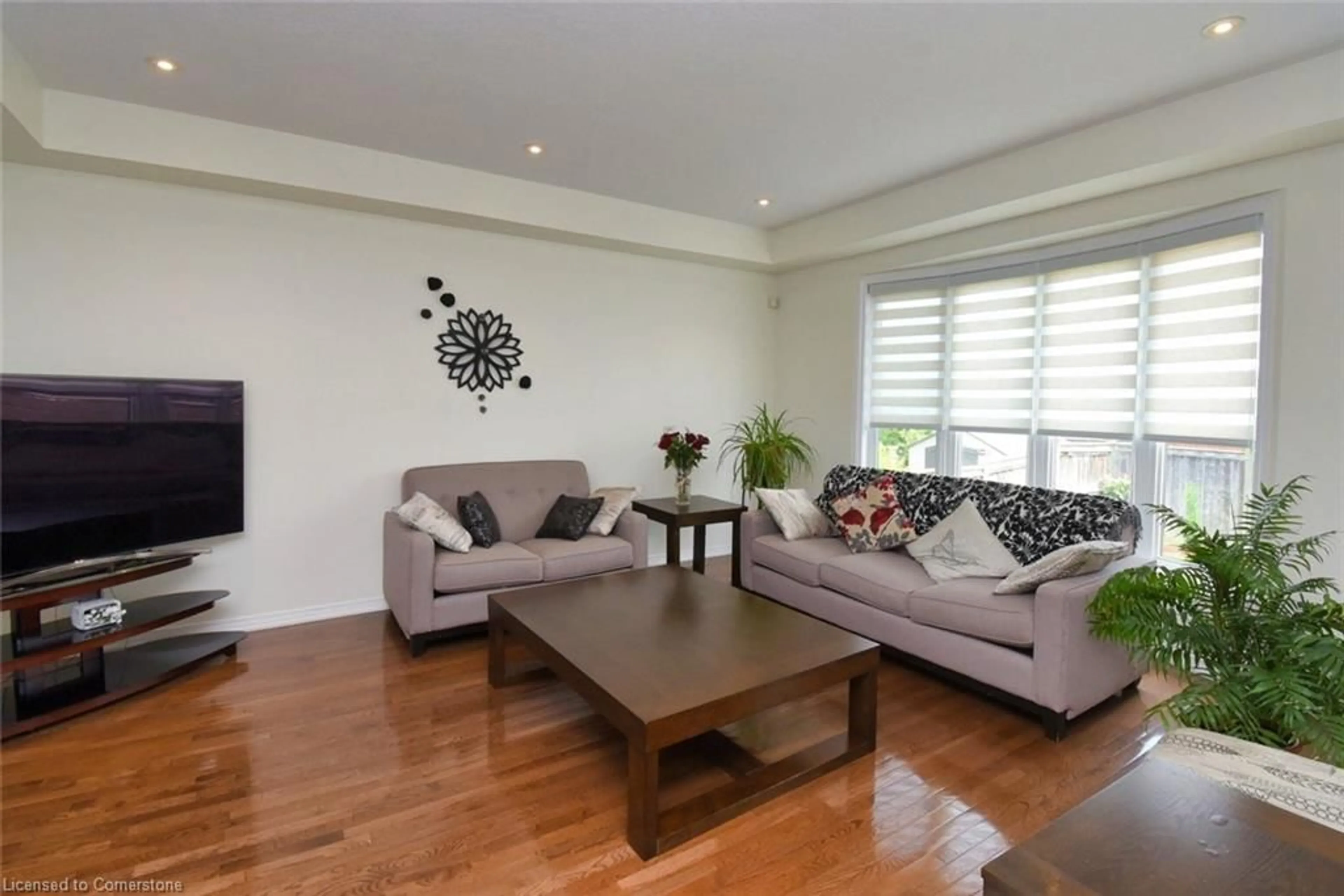 Living room with furniture, wood/laminate floor for 97 Sirente Dr, Hamilton Ontario L9A 0B1