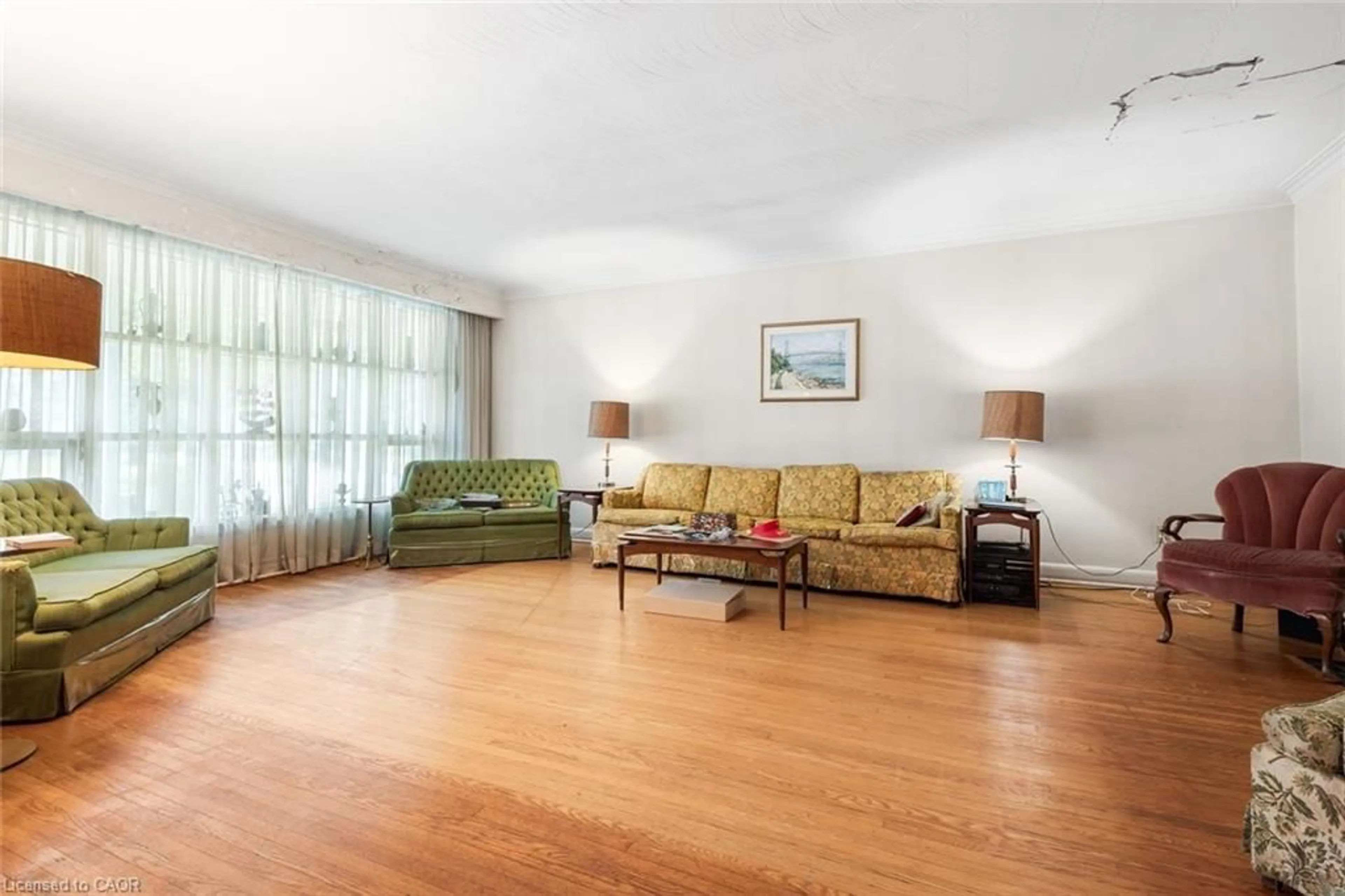 Living room with furniture, wood/laminate floor for 9 Prince George Dr, Etobicoke Ontario M9A 1X9