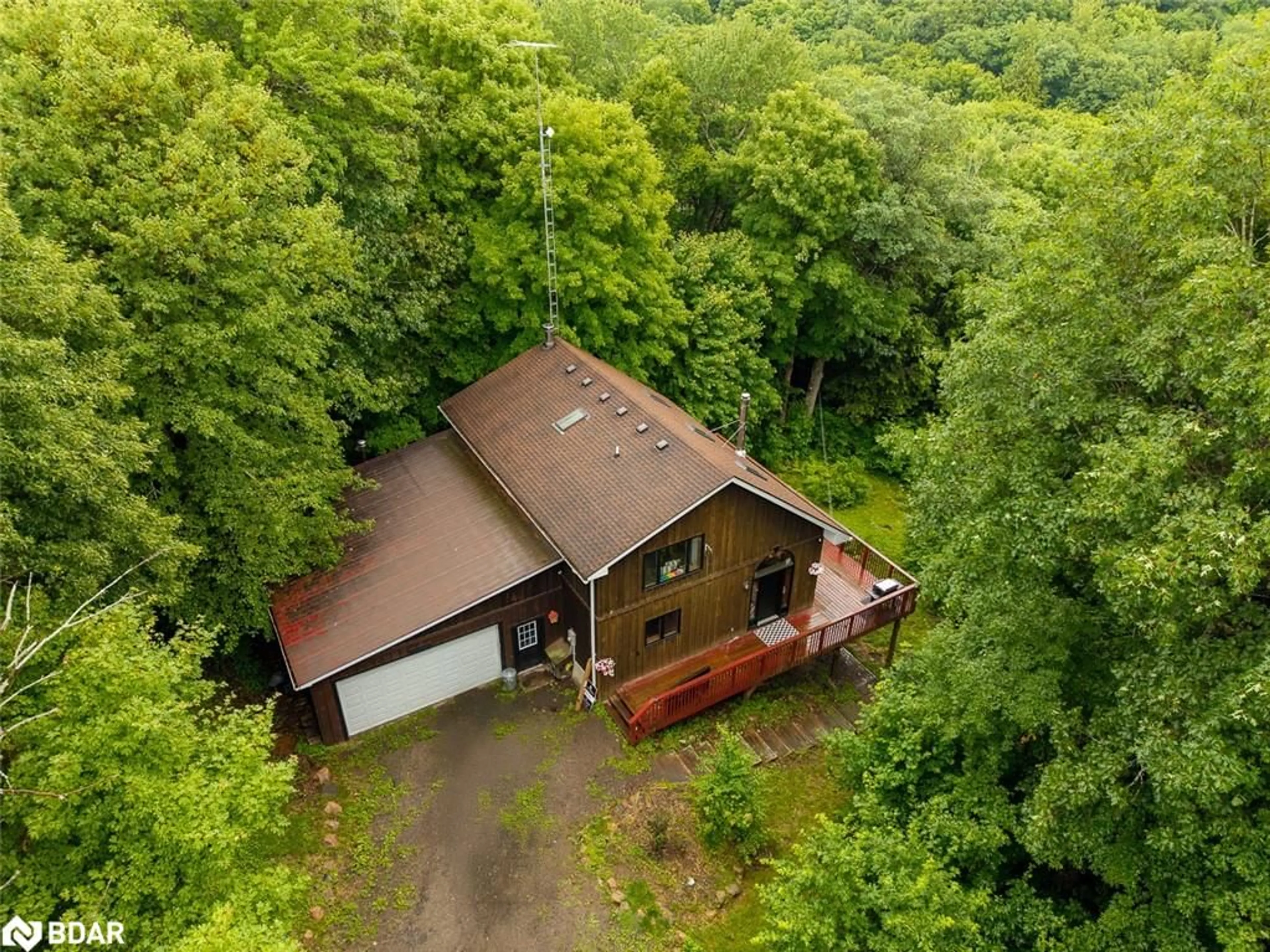 A pic from outside/outdoor area/front of a property/back of a property/a pic from drone, forest/trees view for 806 Clearwater Lake Rd, Port Sydney Ontario P0B 1L0