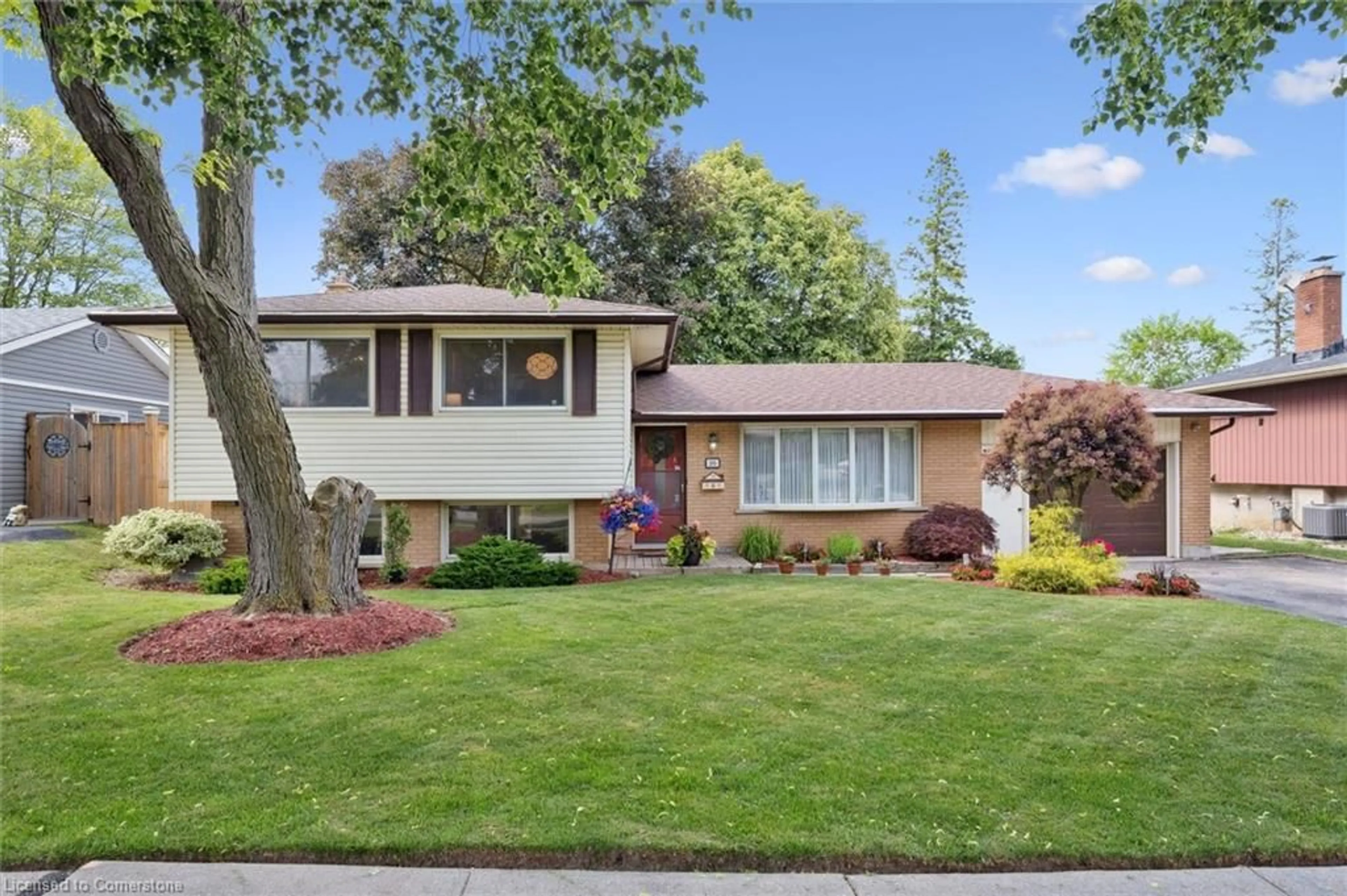 Home with vinyl exterior material, street for 201 Stonybrook Dr, Kitchener Ontario N2M 4L8