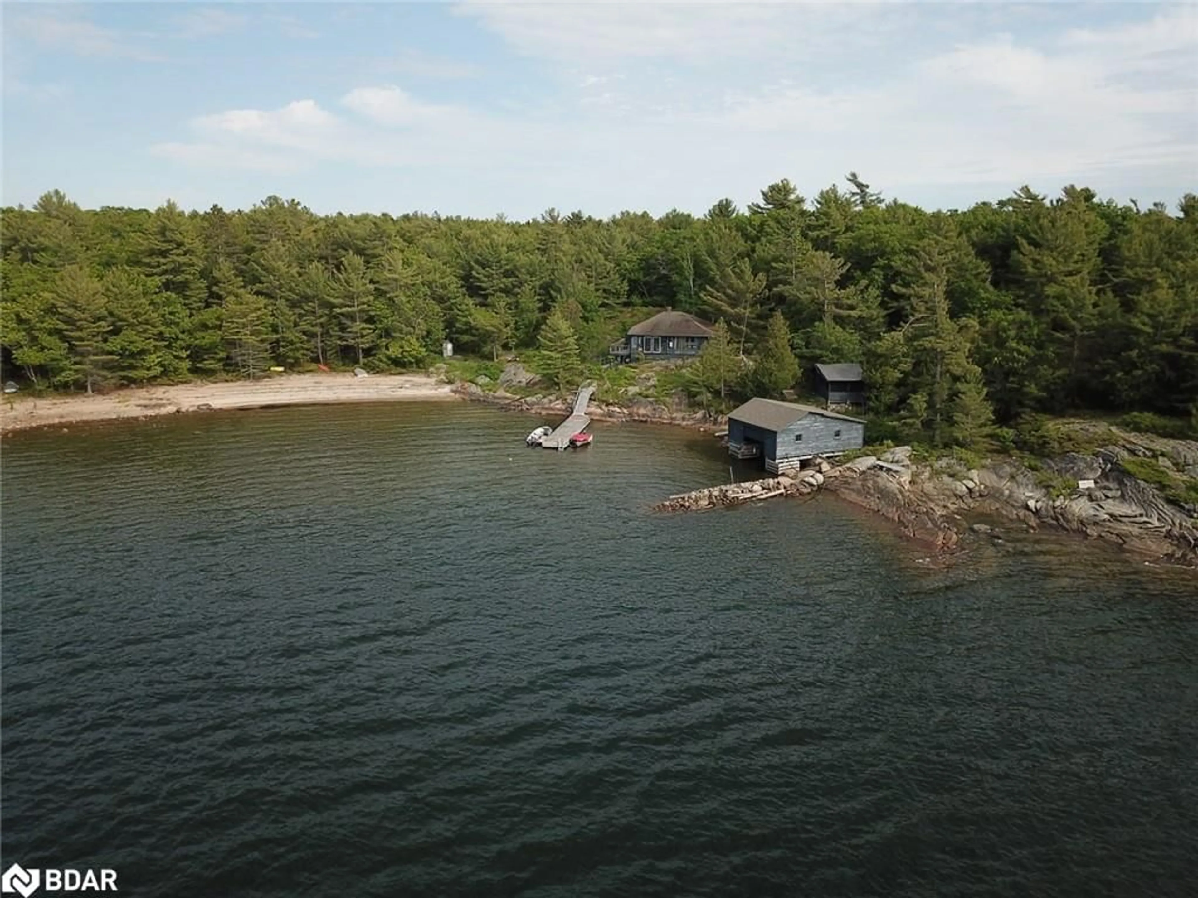 A pic from outside/outdoor area/front of a property/back of a property/a pic from drone, water/lake/river/ocean view for 25 Shawanaga Landing Rd, Pointe au Baril Ontario P0G 1K0