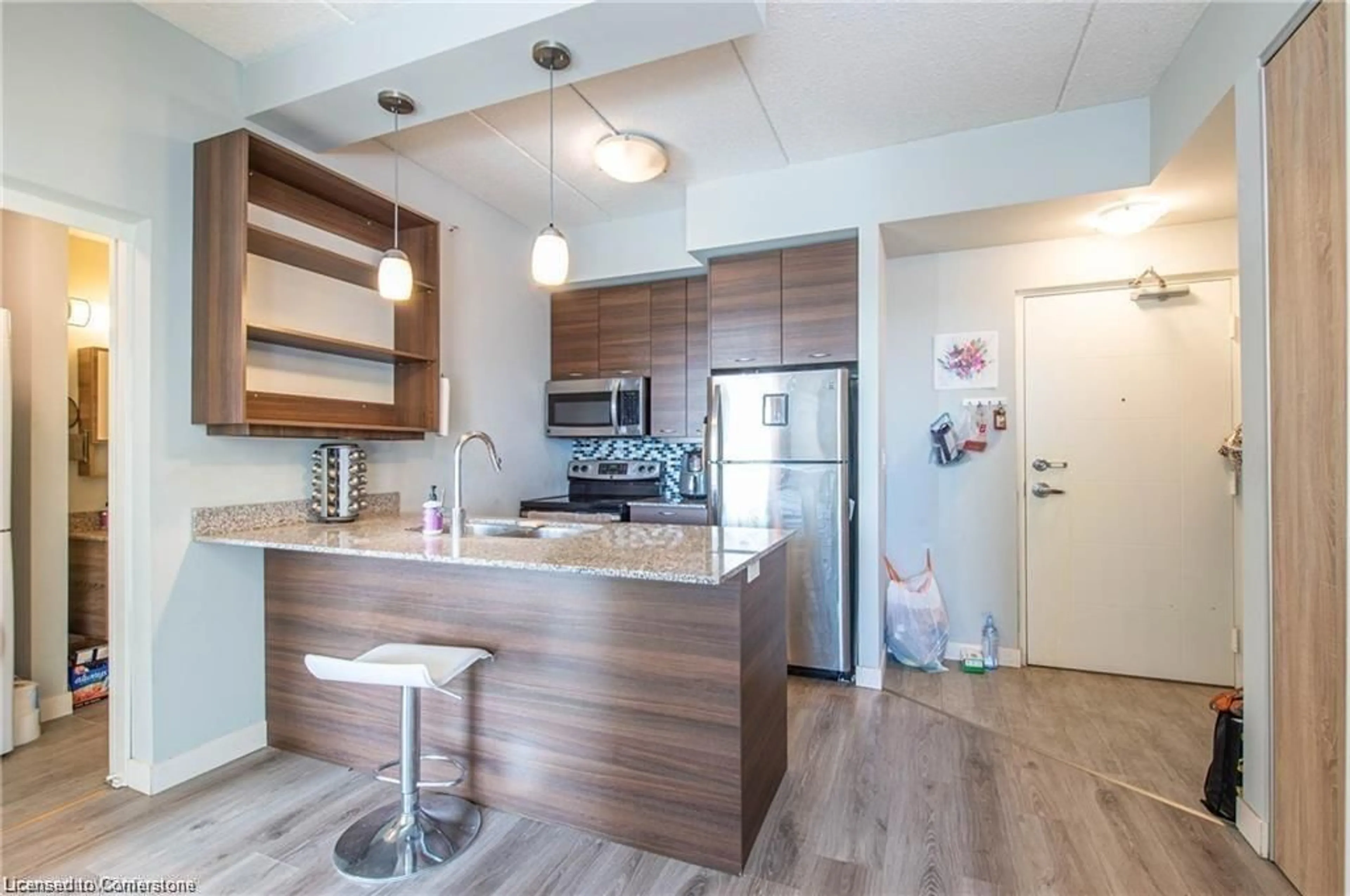 Open concept kitchen, wood/laminate floor for 318 Spruce St #1804, Waterloo Ontario N2L 3M6