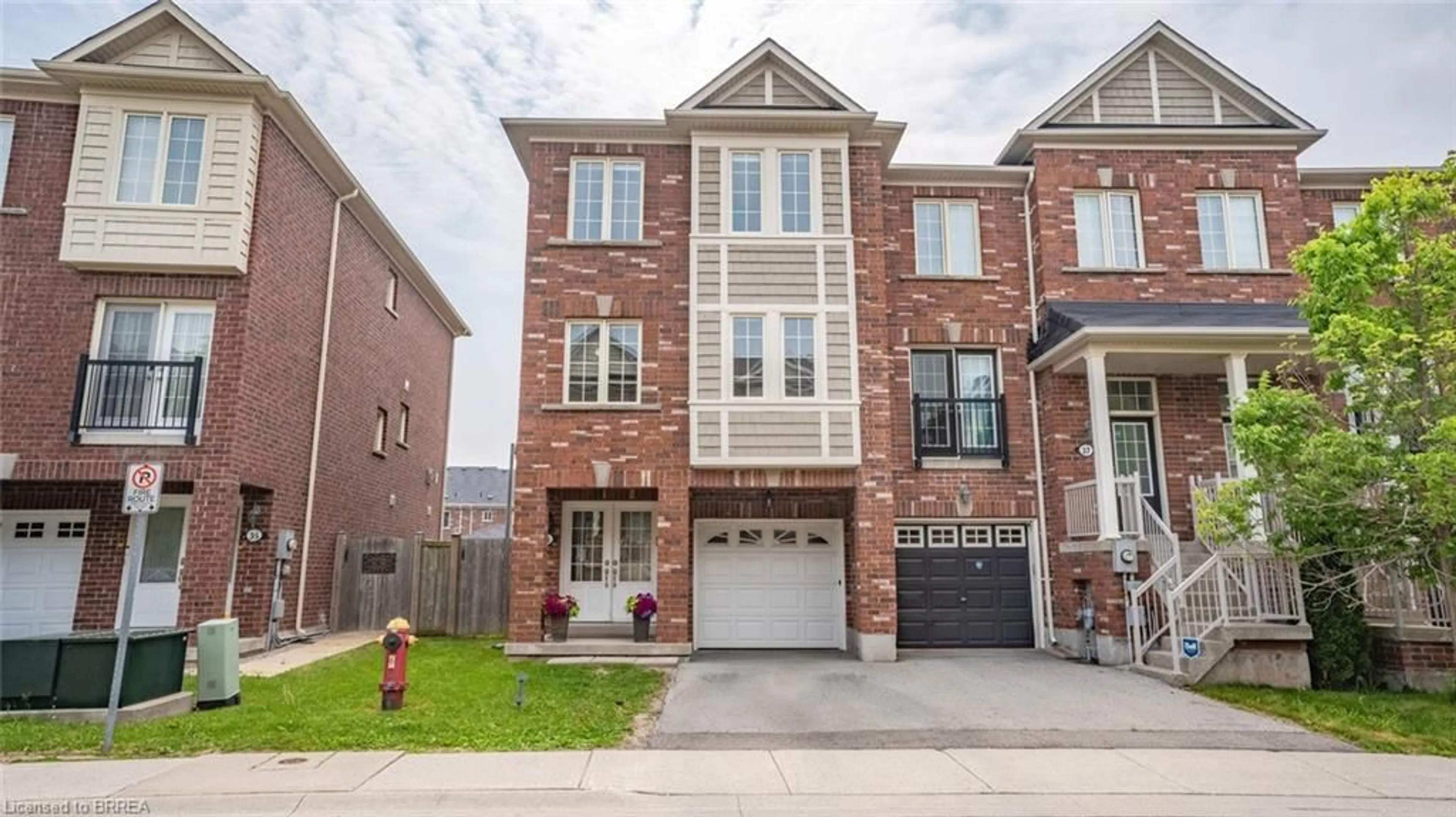 Home with brick exterior material, street for 2186 Fiddlers Way #36, Oakville Ontario L6M 0L5