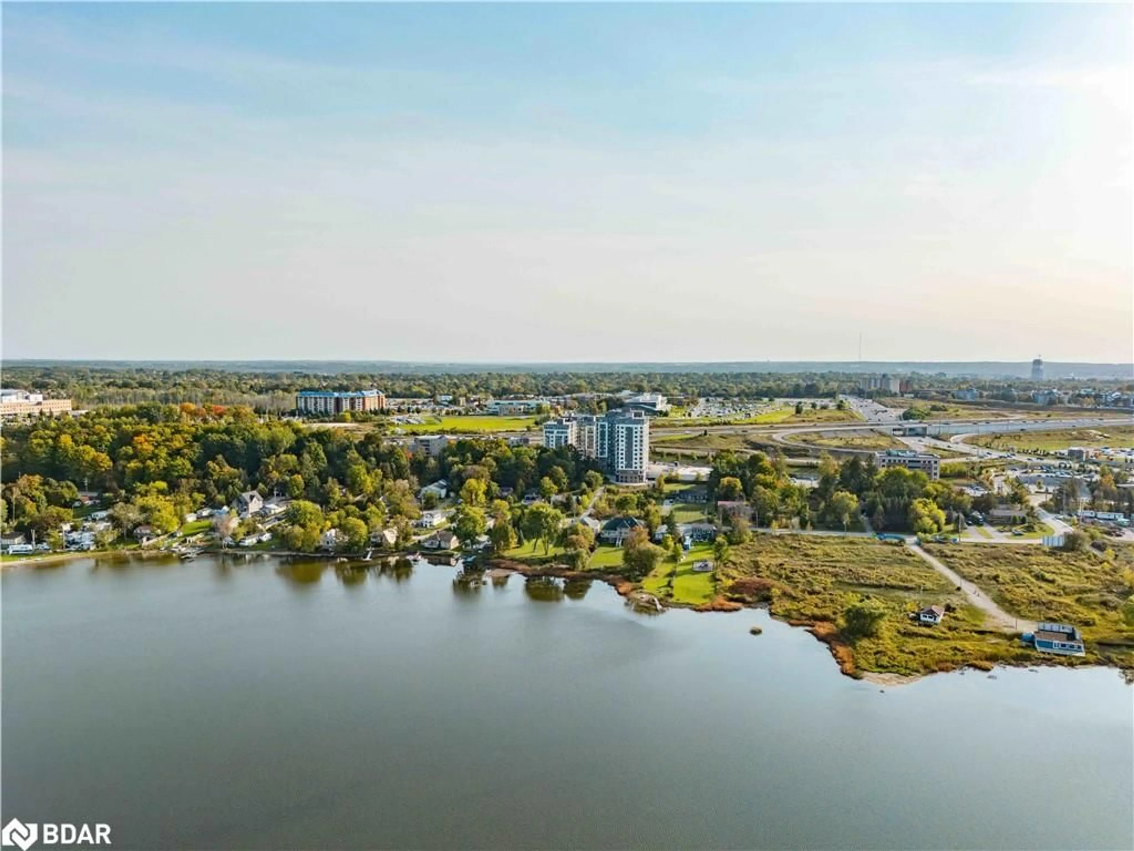A pic from outside/outdoor area/front of a property/back of a property/a pic from drone, water/lake/river/ocean view for 58 Lakeside Terrace #207, Barrie Ontario L4M 0L5