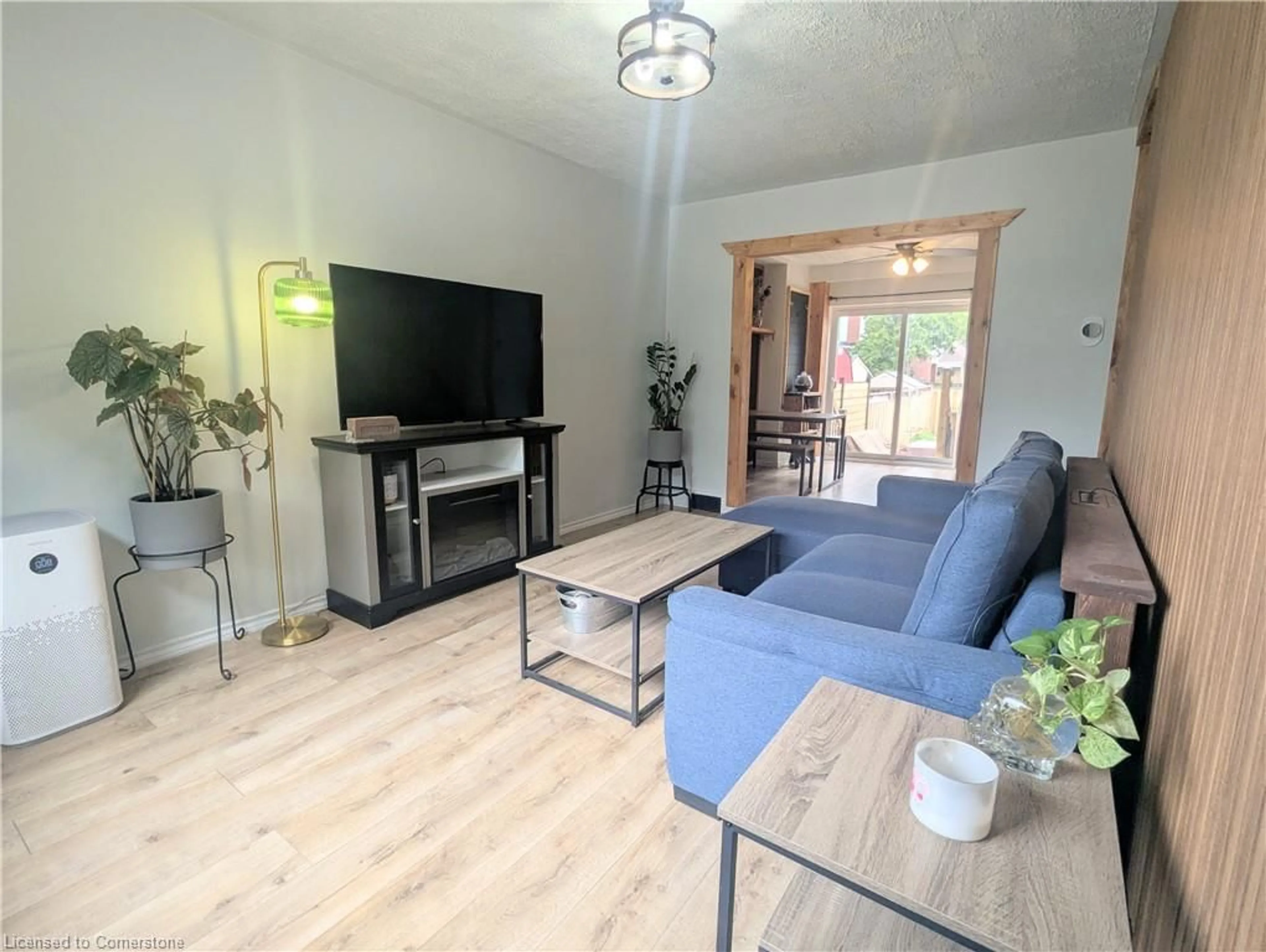 Living room with furniture, wood/laminate floor for 128 Balsam Ave, Hamilton Ontario L8L 6Y3