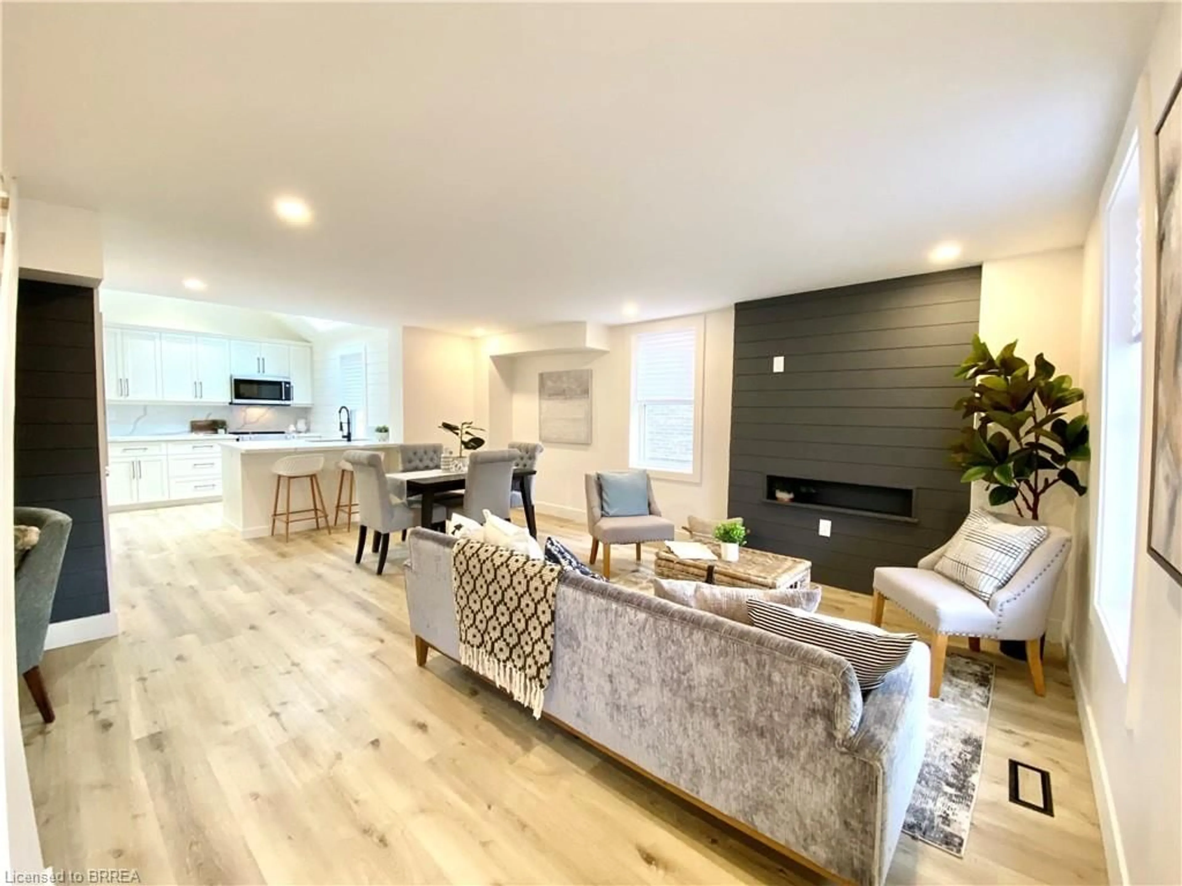 Living room with furniture, wood/laminate floor for 169 Murray St, Brantford Ontario N3S 5R3