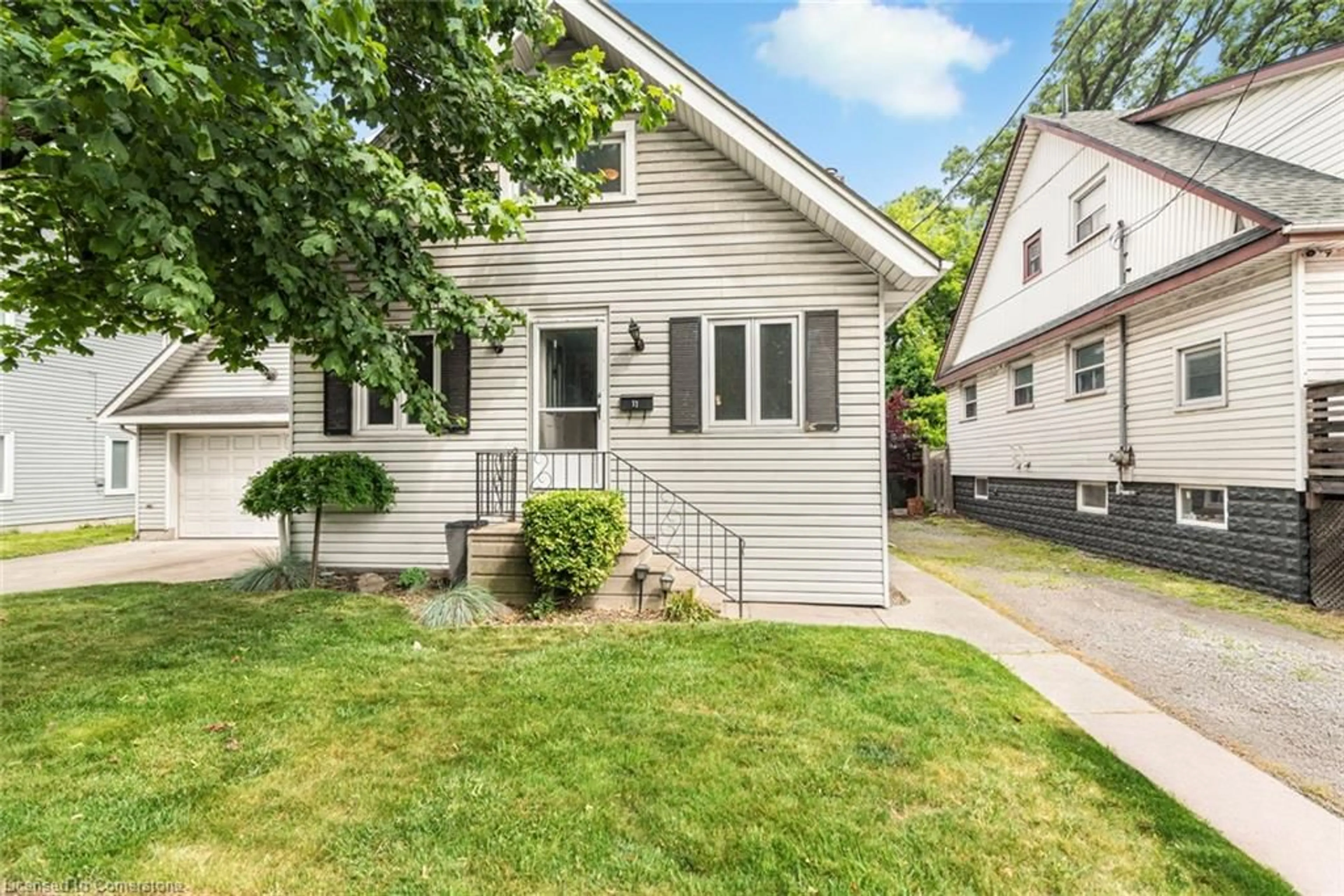 Home with vinyl exterior material, street for 11 Grafton Ave, Hamilton Ontario L8H 7E6