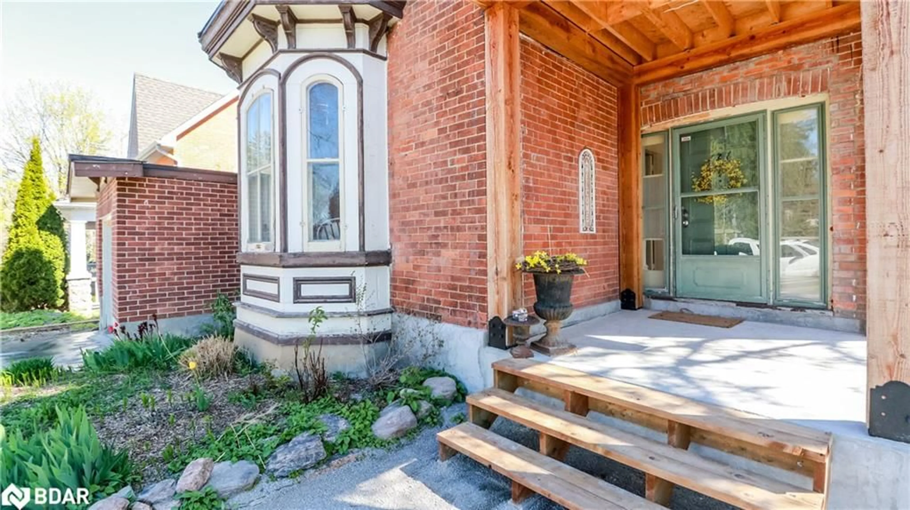 Home with brick exterior material, street for 121 Mulcaster St, Barrie Ontario L4M 3M8