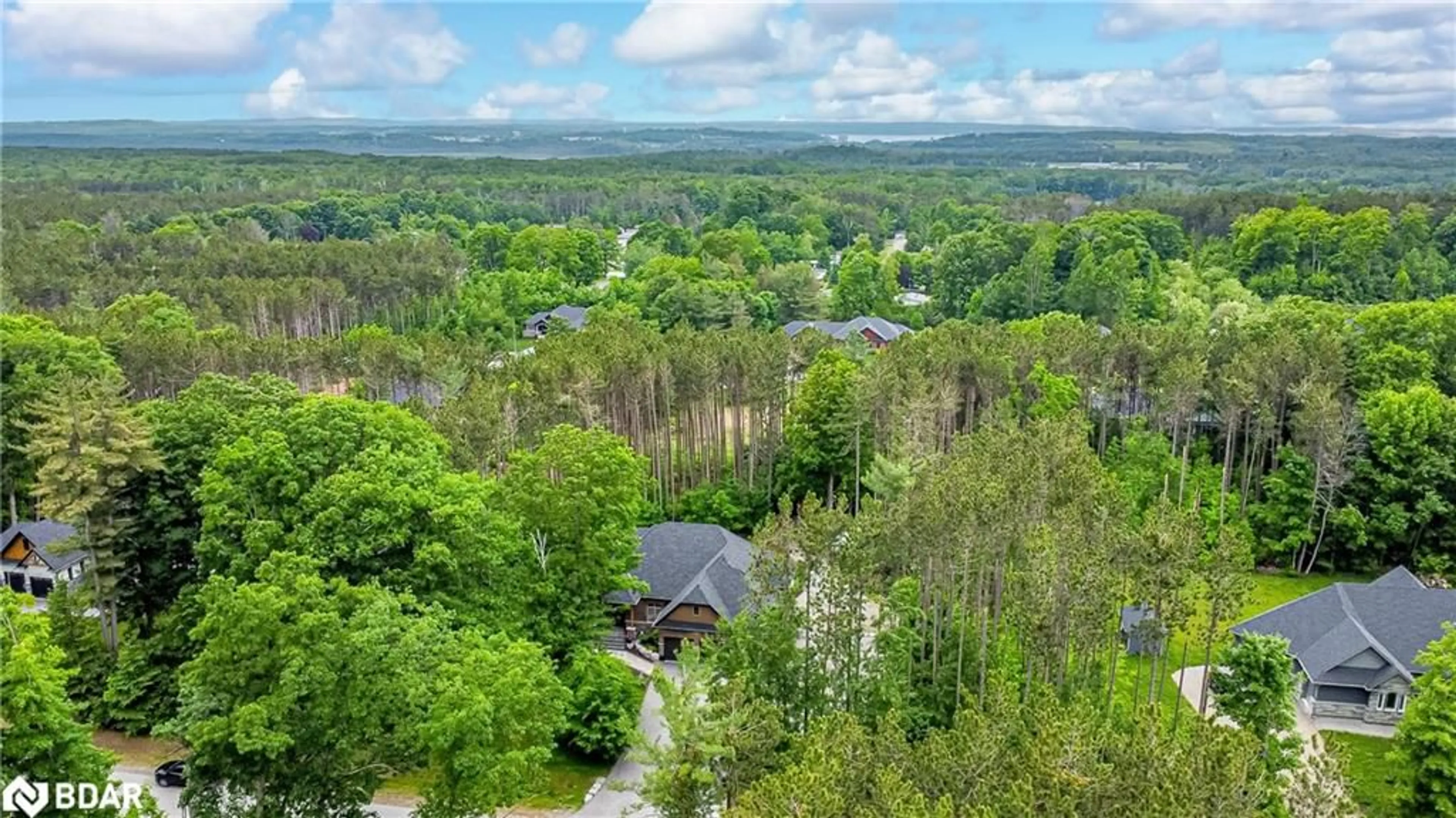 A pic from outside/outdoor area/front of a property/back of a property/a pic from drone, forest/trees view for 38 Windermere Cir, Tay Ontario L4R 0C3
