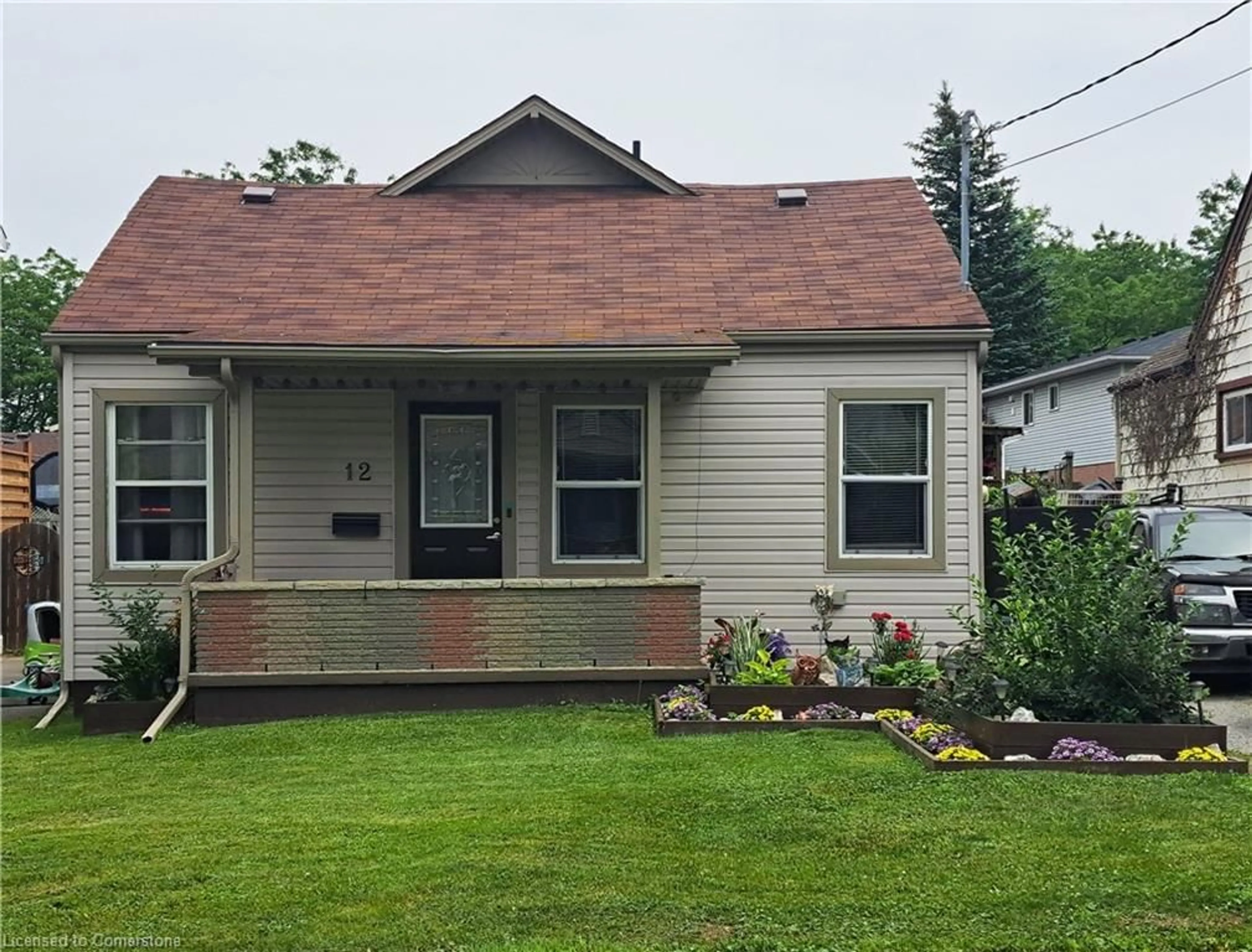 Home with vinyl exterior material, street for 12 Hayes St, St. Catharines Ontario L2T 1N6