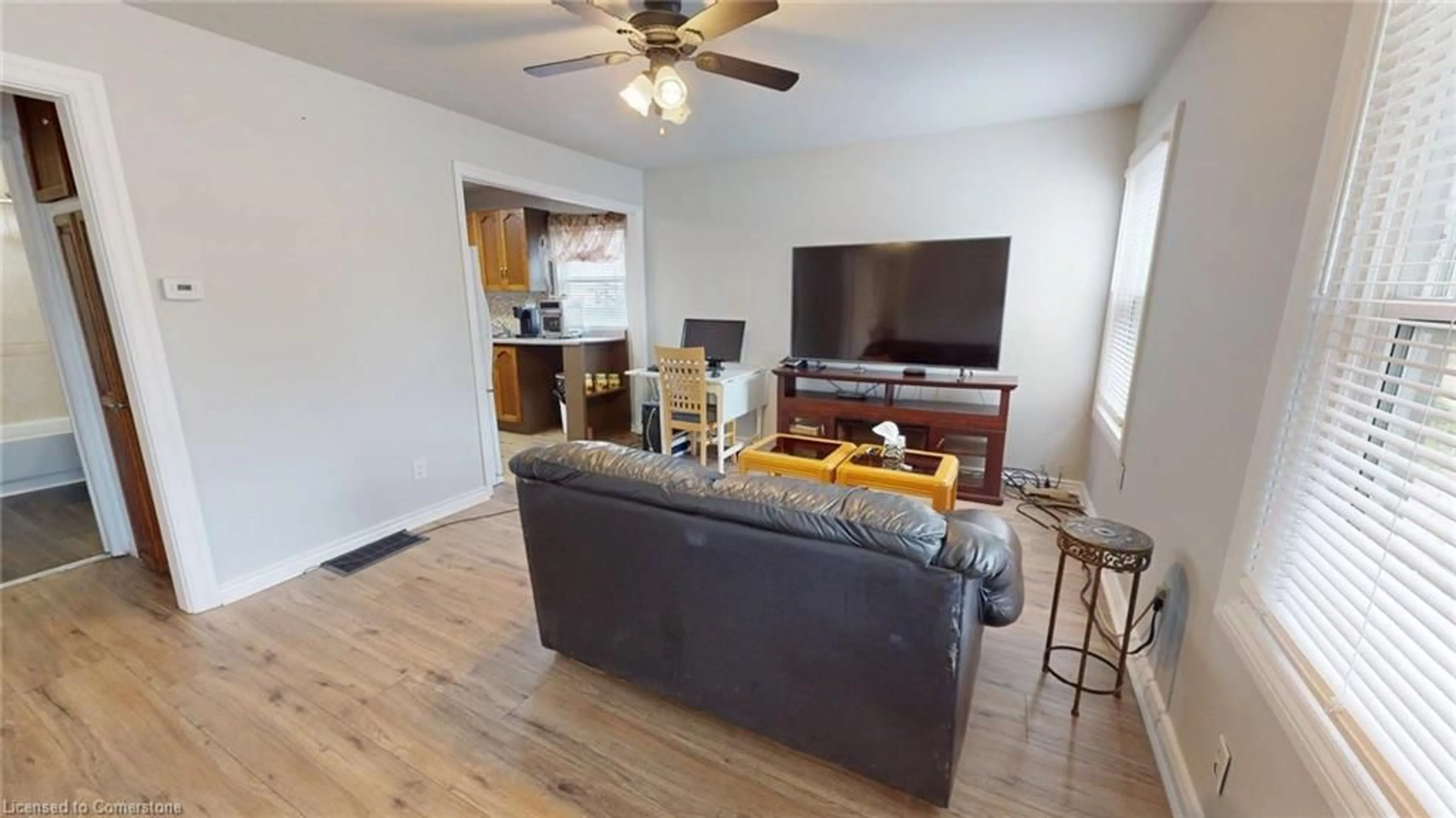 Living room with furniture, wood/laminate floor for 12 Hayes St, St. Catharines Ontario L2T 1N6