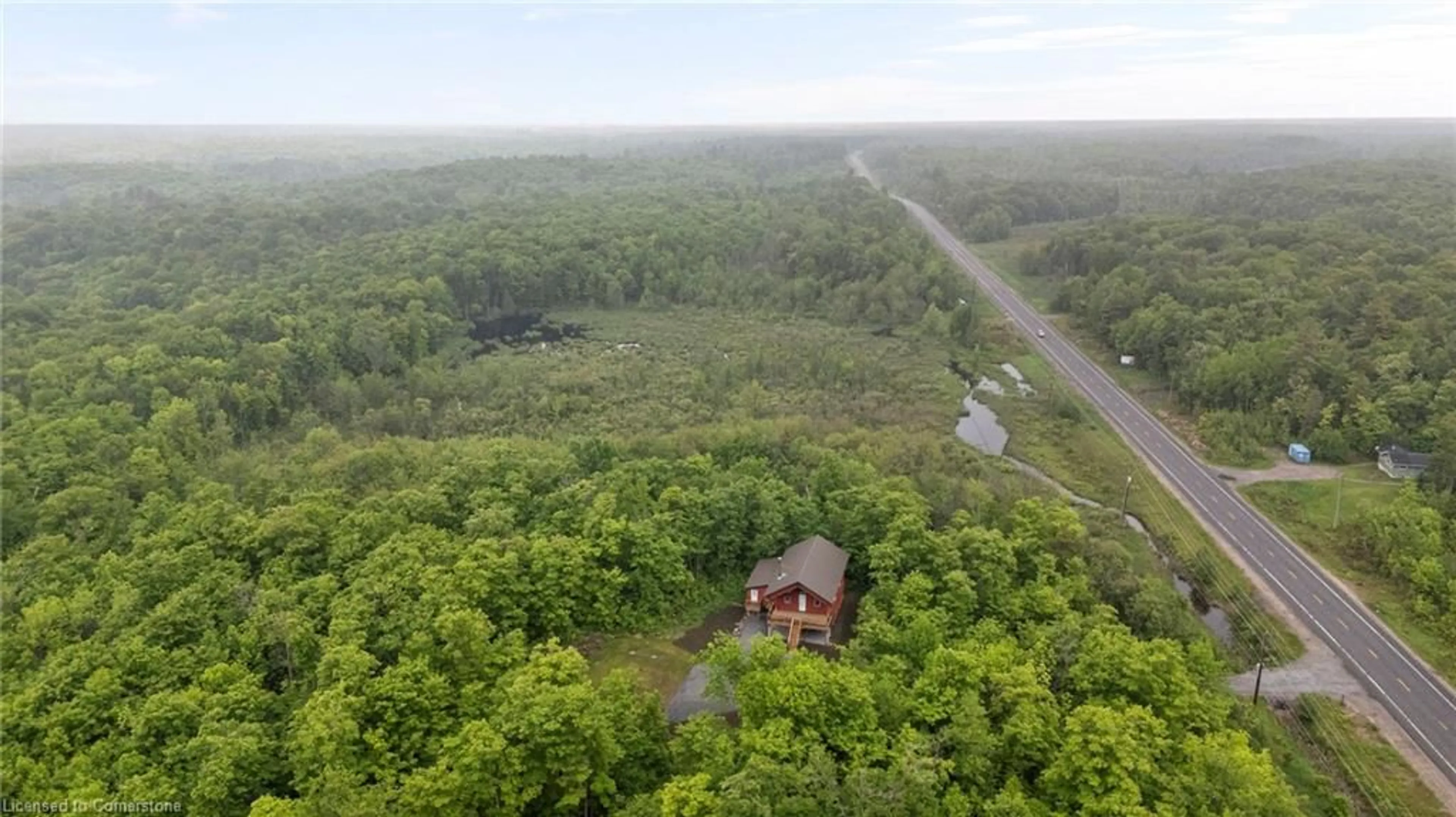 A pic from outside/outdoor area/front of a property/back of a property/a pic from drone, forest/trees view for 1414 Highway 124, Dunchurch Ontario P0A 1G0