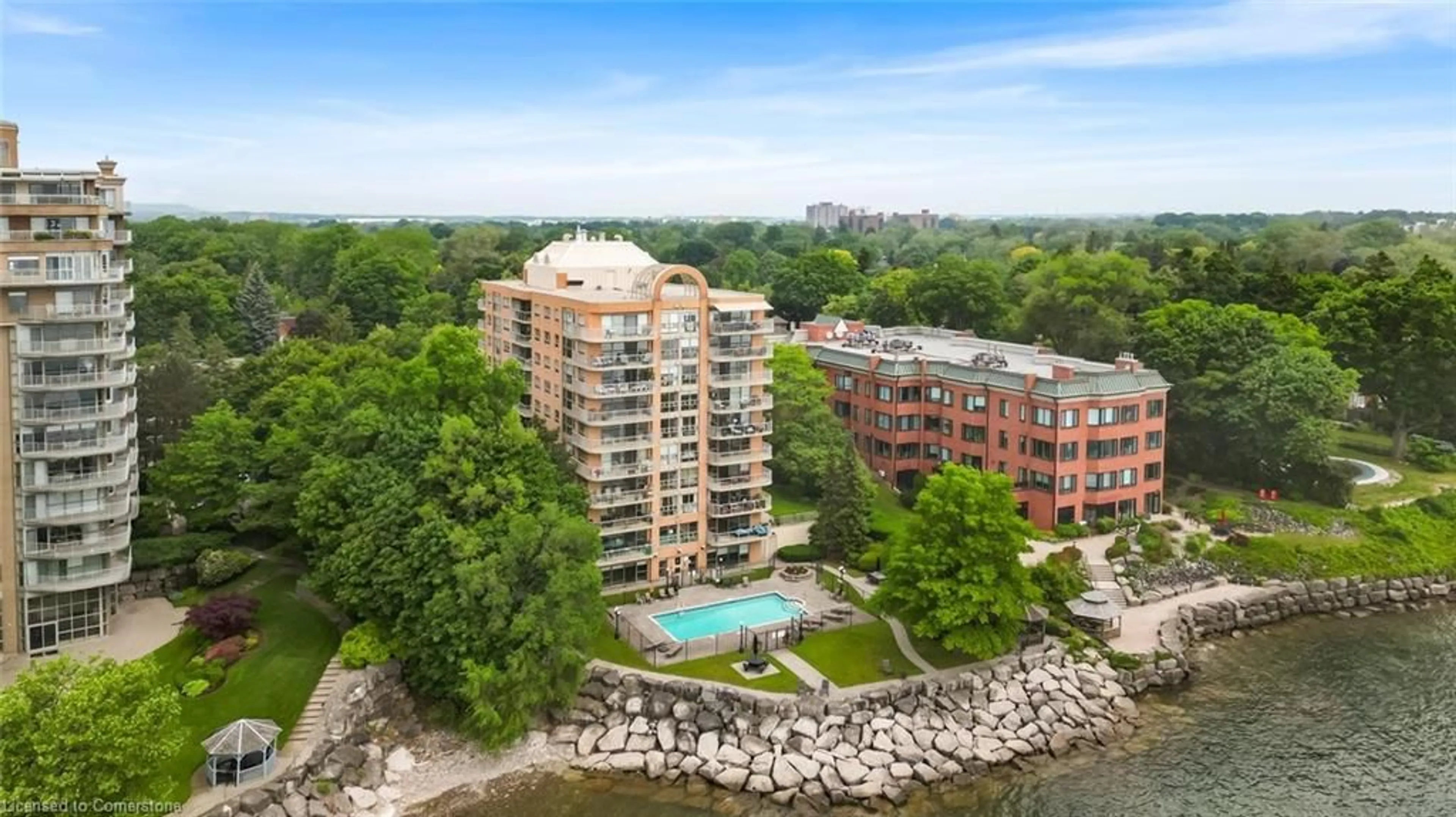 A pic from outside/outdoor area/front of a property/back of a property/a pic from drone, water/lake/river/ocean view for 2210 Lakeshore Rd #104, Burlington Ontario L7R 4J9