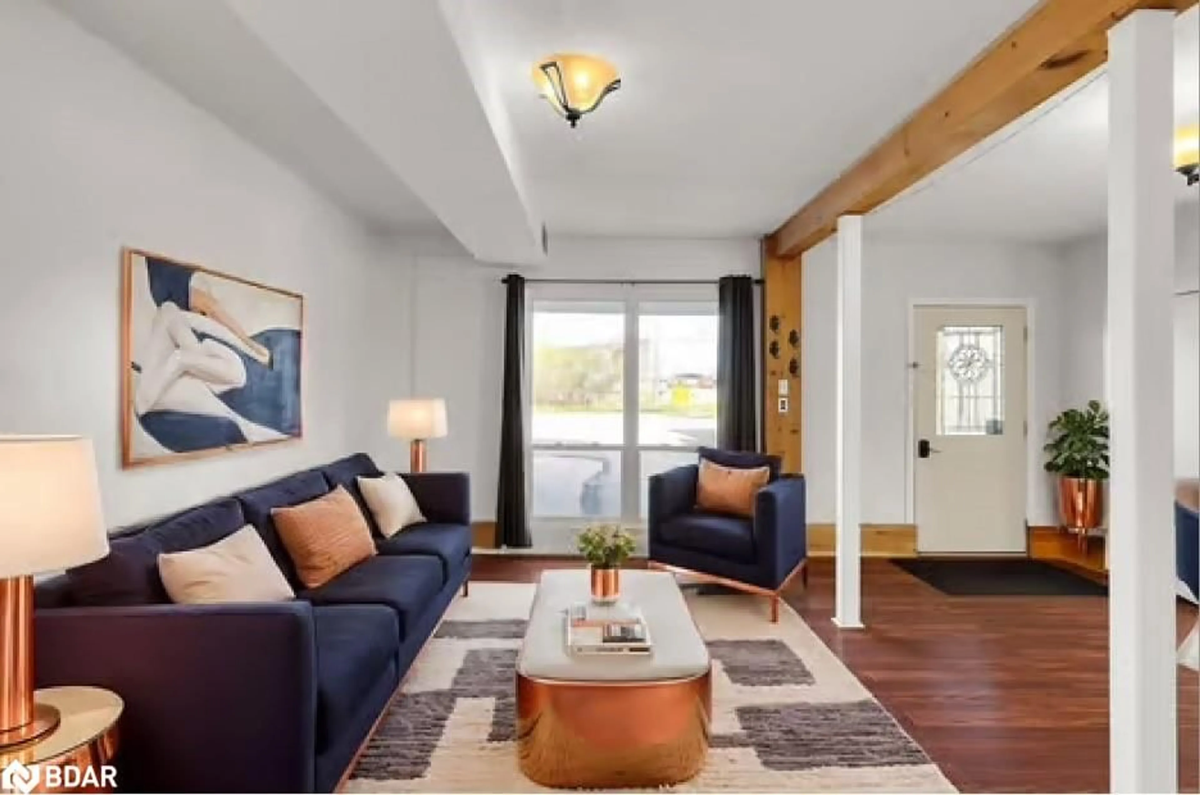 Living room with furniture, wood/laminate floor for 3 Courtland St, Orillia Ontario L3V 1A4