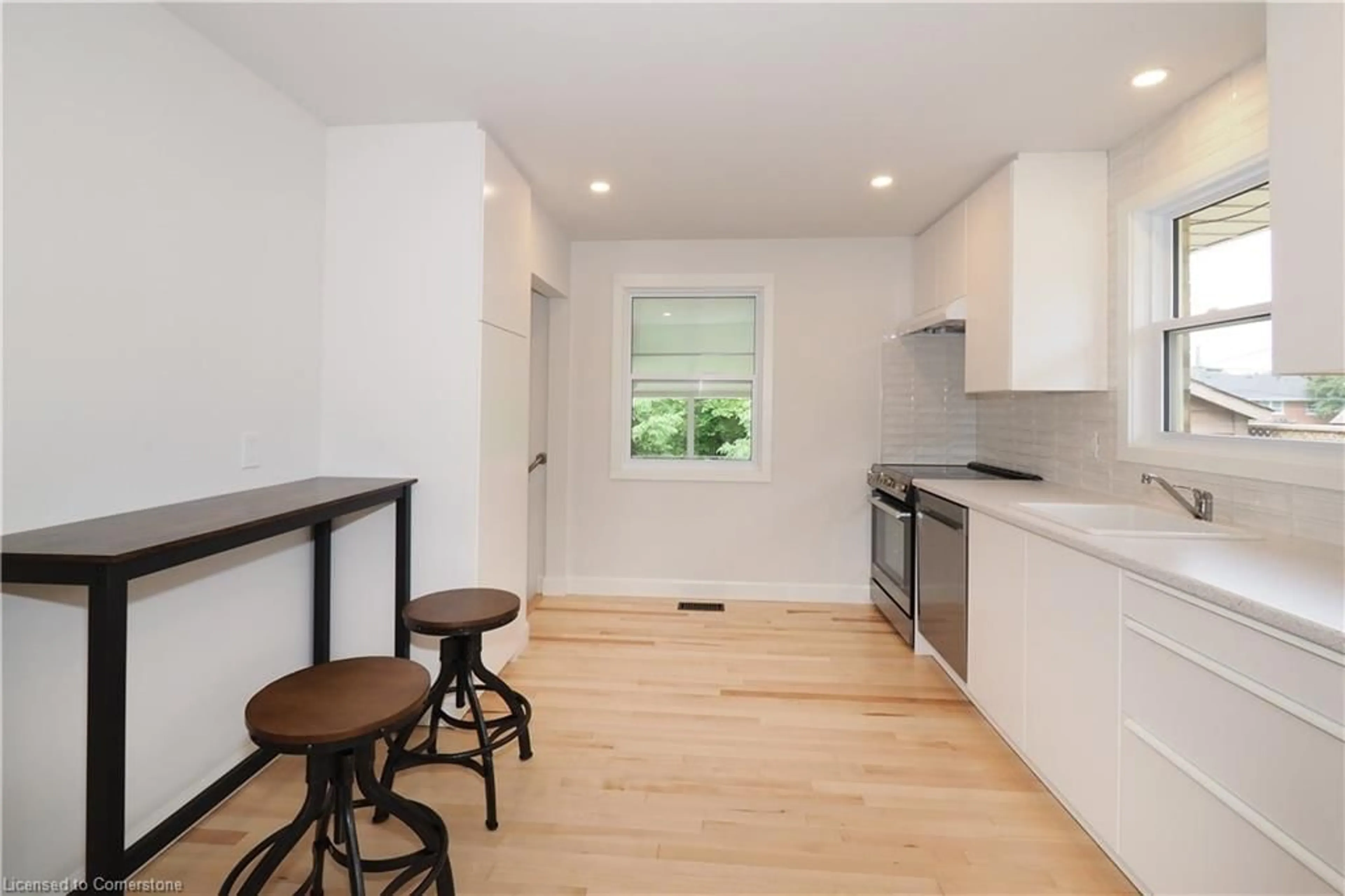 Open concept kitchen, wood/laminate floor for 383 Dumfries Ave, Kitchener Ontario N2H 2E9