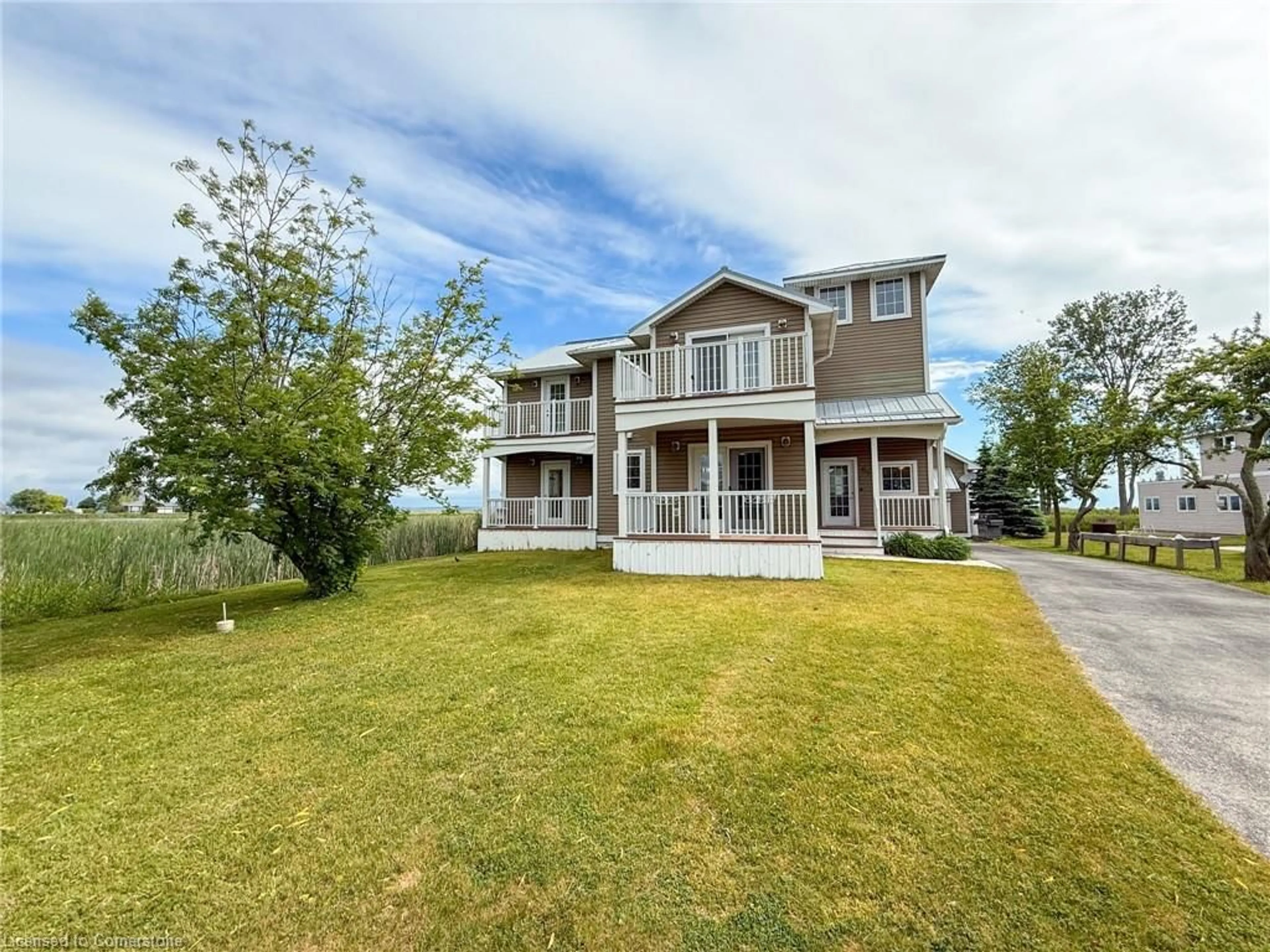 A pic from outside/outdoor area/front of a property/back of a property/a pic from drone, water/lake/river/ocean view for 63 Old Cut Blvd, Long Point Ontario N0E 1M0