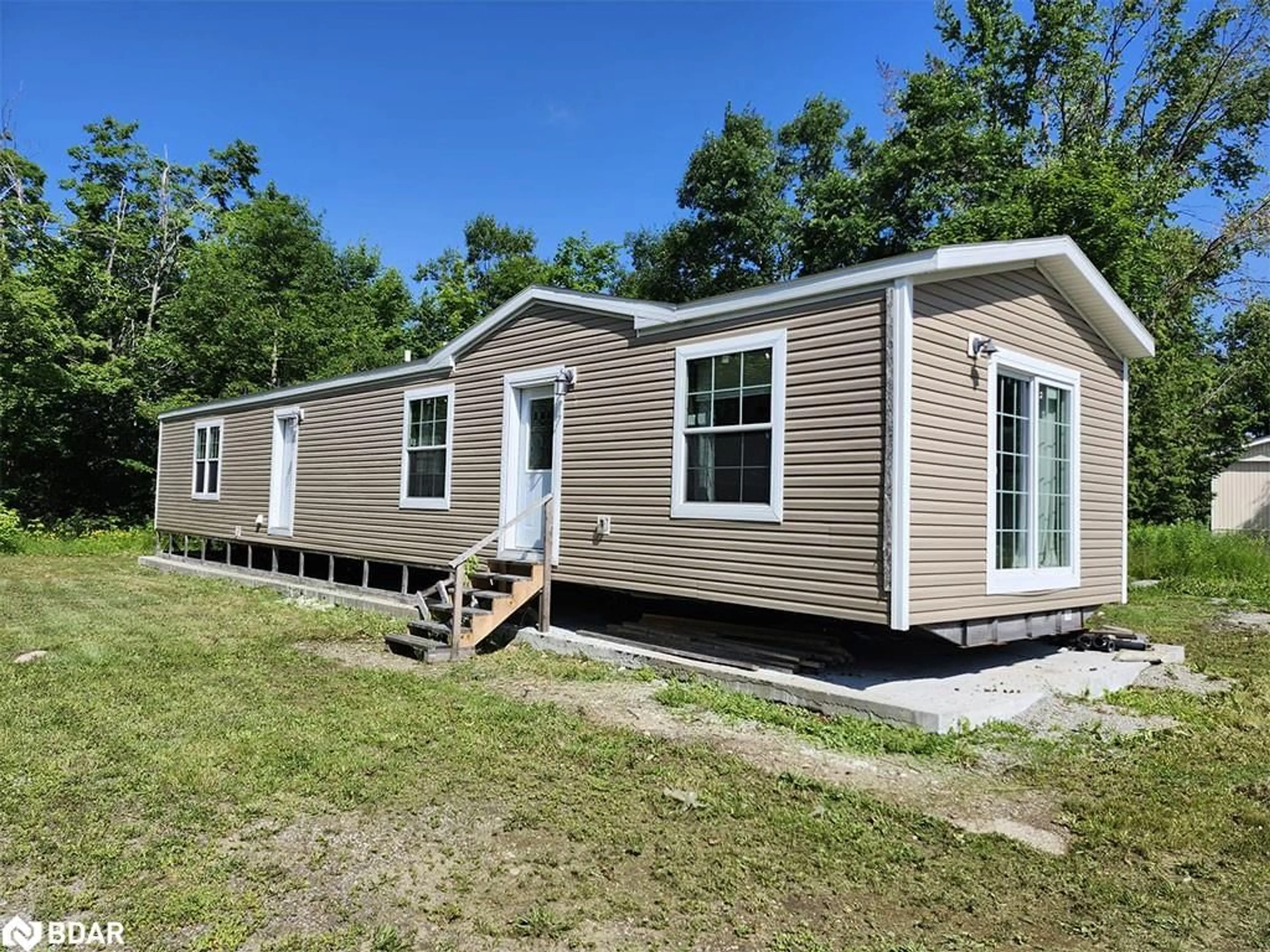 Home with vinyl exterior material, building for 45 Tower Rd #4, MacTier Ontario P0C 1H0