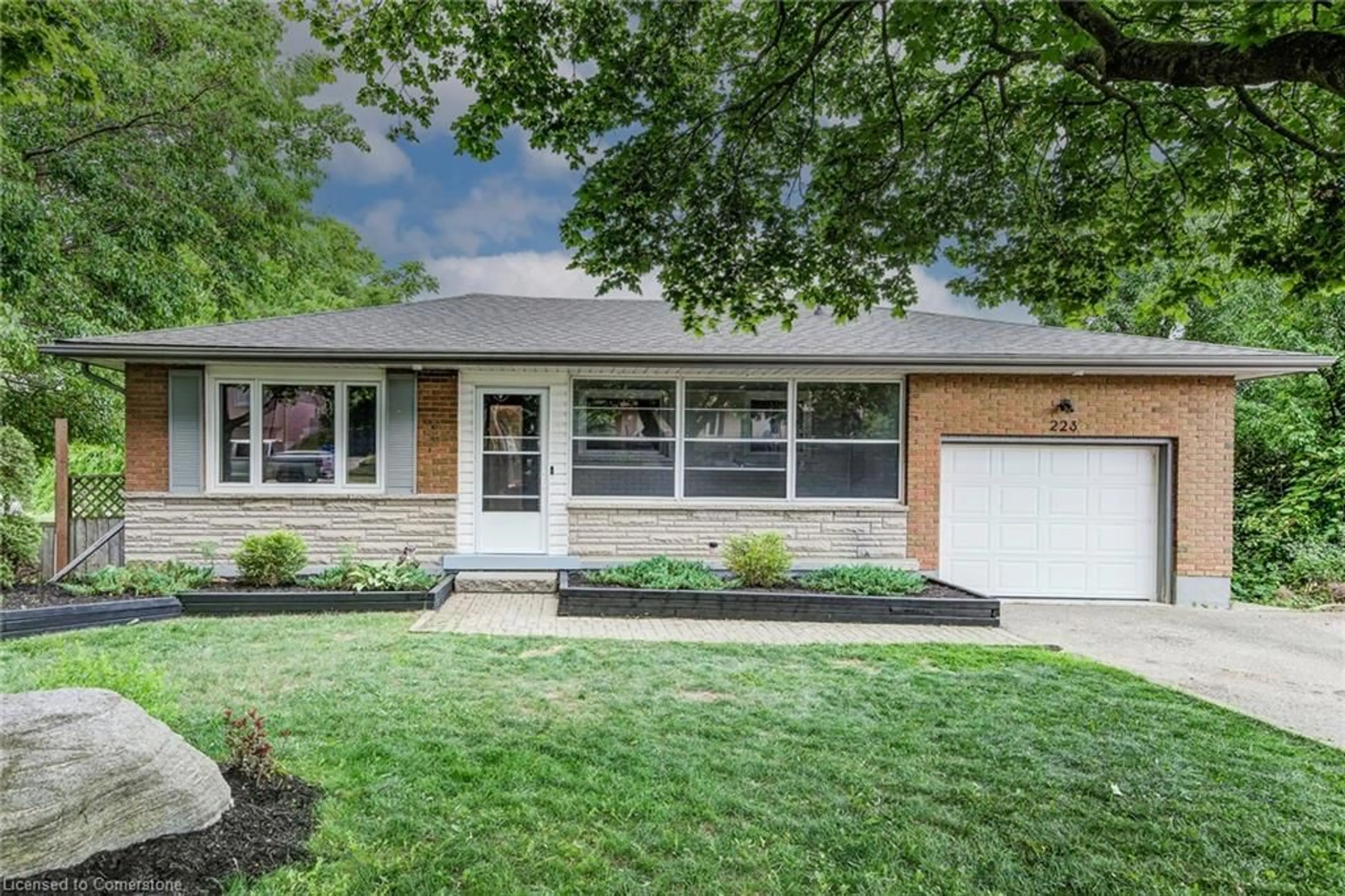 Home with brick exterior material, street for 223 Williamsburg Rd, Kitchener Ontario N2E 1K8