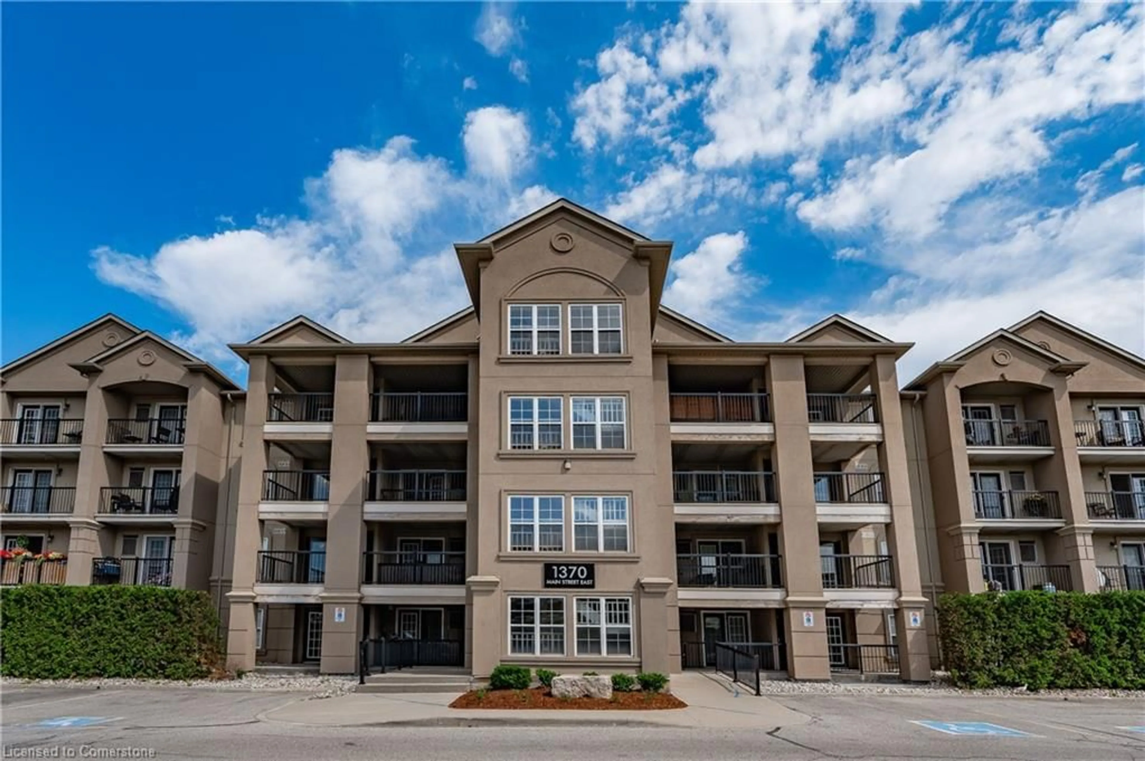 A pic from outside/outdoor area/front of a property/back of a property/a pic from drone, building for 1370 Main St #409, Milton Ontario L9T 7S8