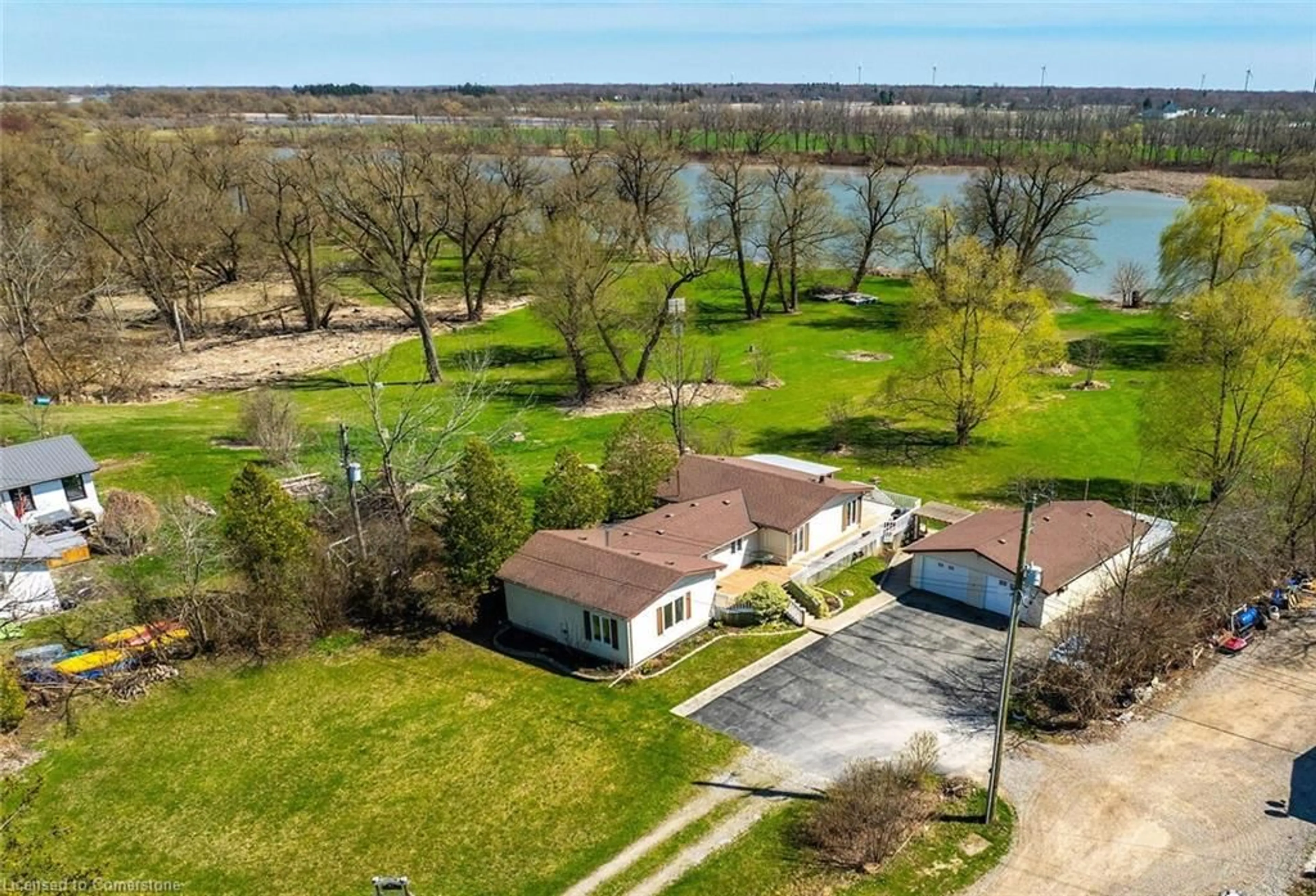 A pic from outside/outdoor area/front of a property/back of a property/a pic from drone, water/lake/river/ocean view for 657 Haldimand Road 17, Dunnville Ontario N1A 2W4