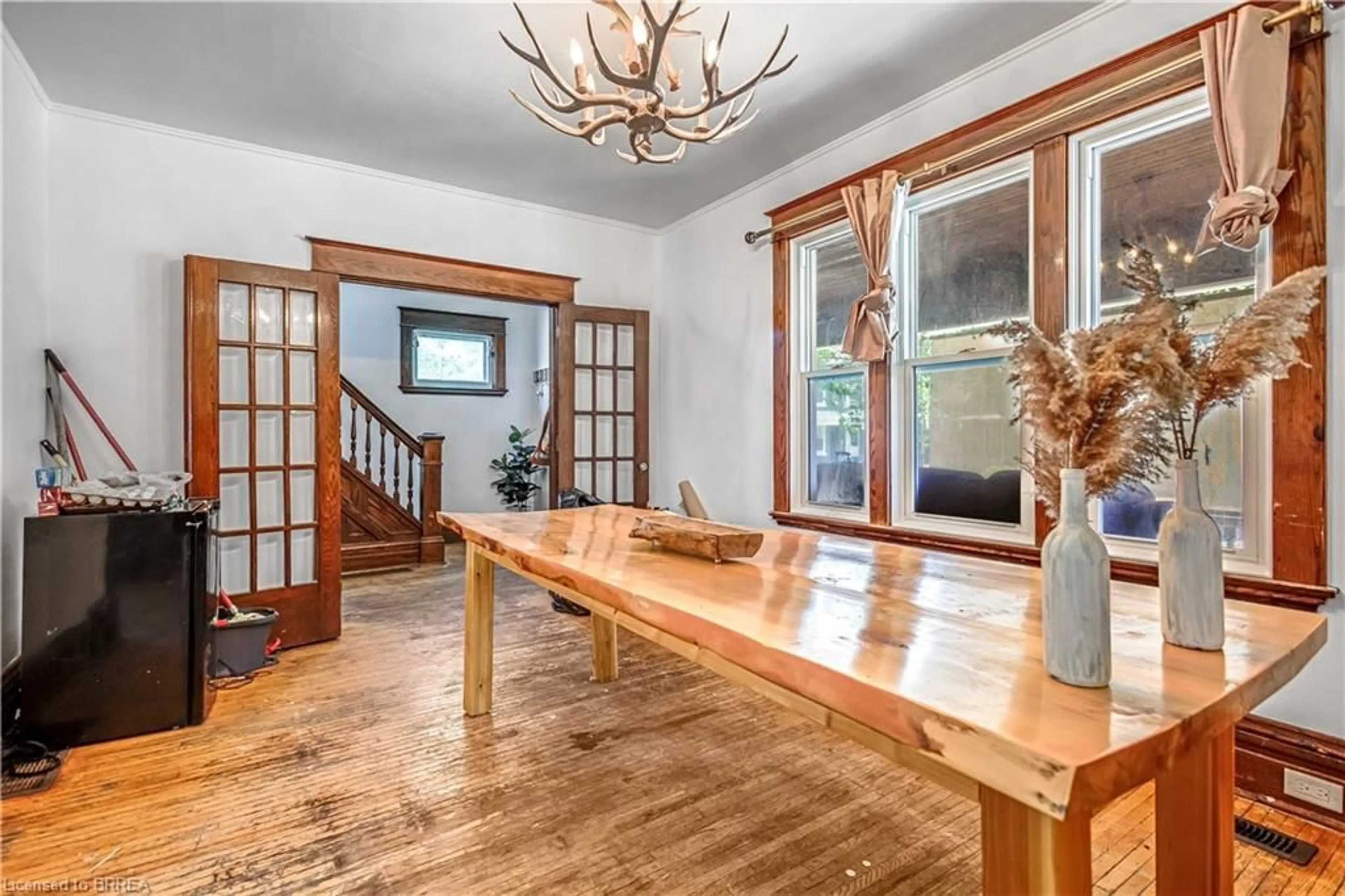 Dining room, wood/laminate floor for 94 Peel St, Brantford Ontario N3S 5M4