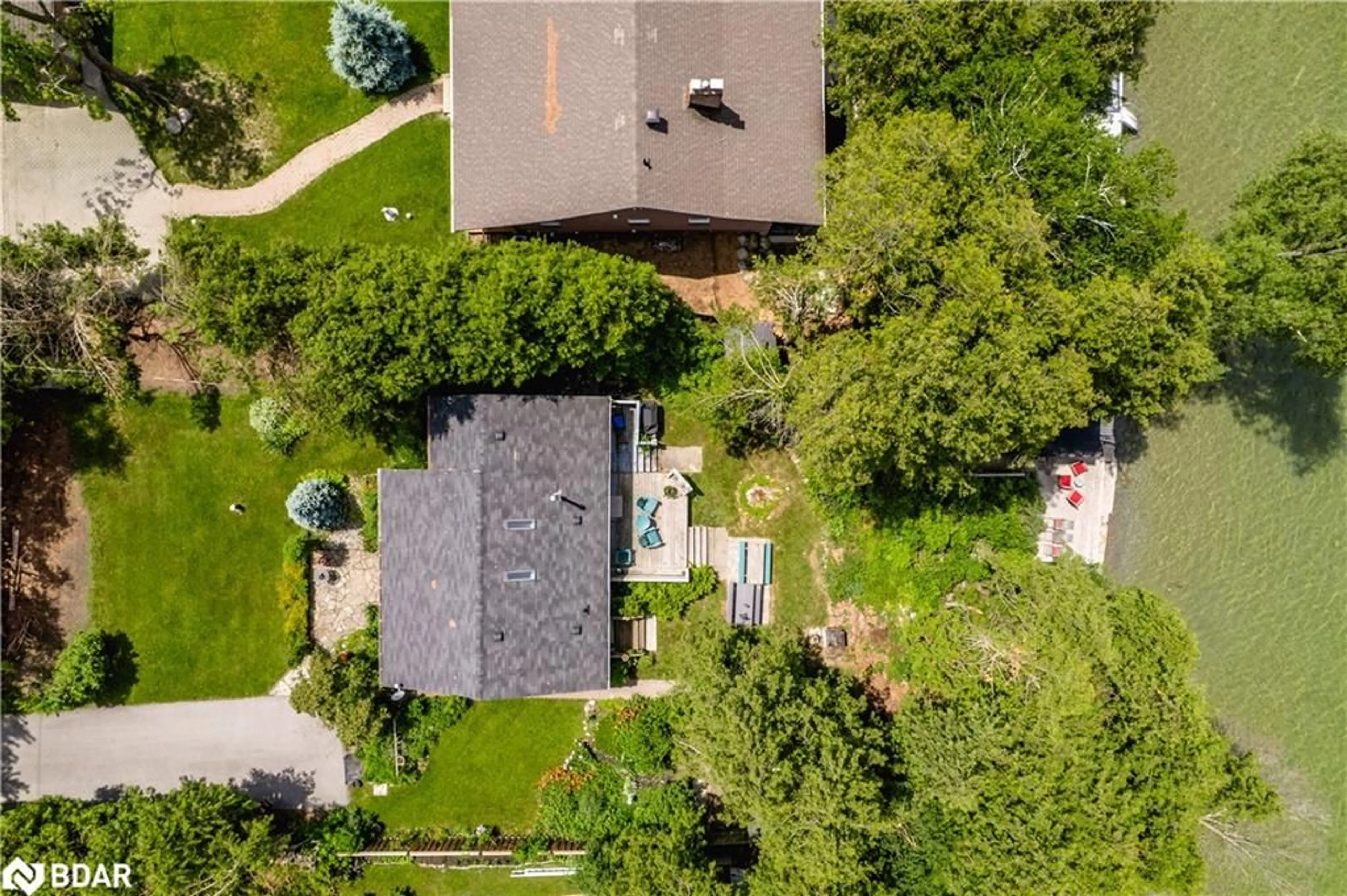 A pic from outside/outdoor area/front of a property/back of a property/a pic from drone, street for 24890 Thorah Park Blvd, Beaverton Ontario L0K 1A0