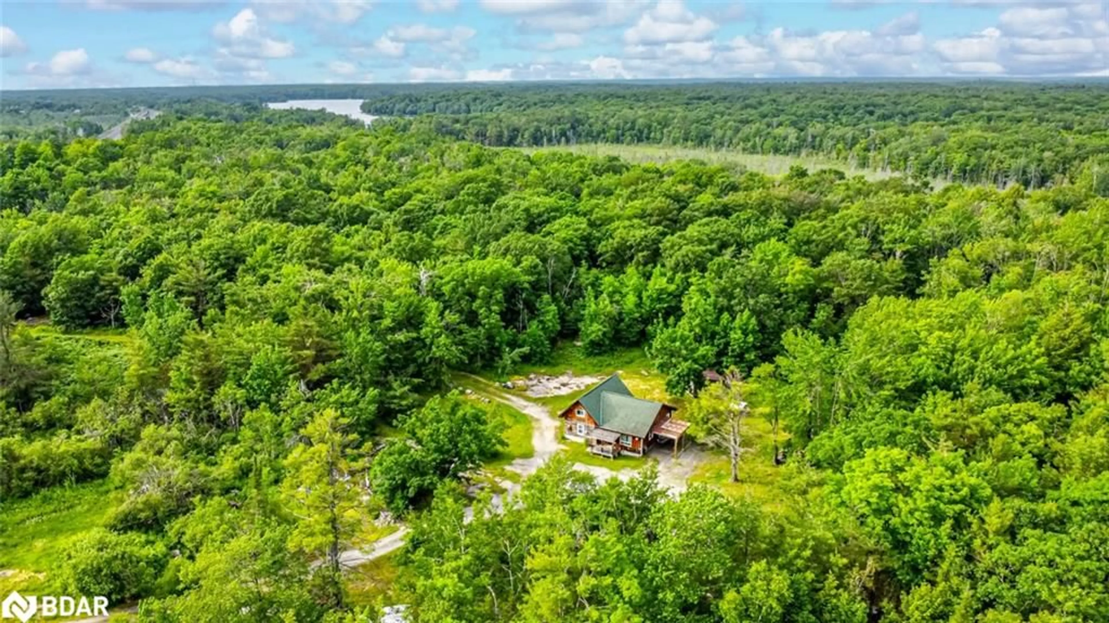 A pic from outside/outdoor area/front of a property/back of a property/a pic from drone, water/lake/river/ocean view for 94 High St, MacTier Ontario P0C 1H0