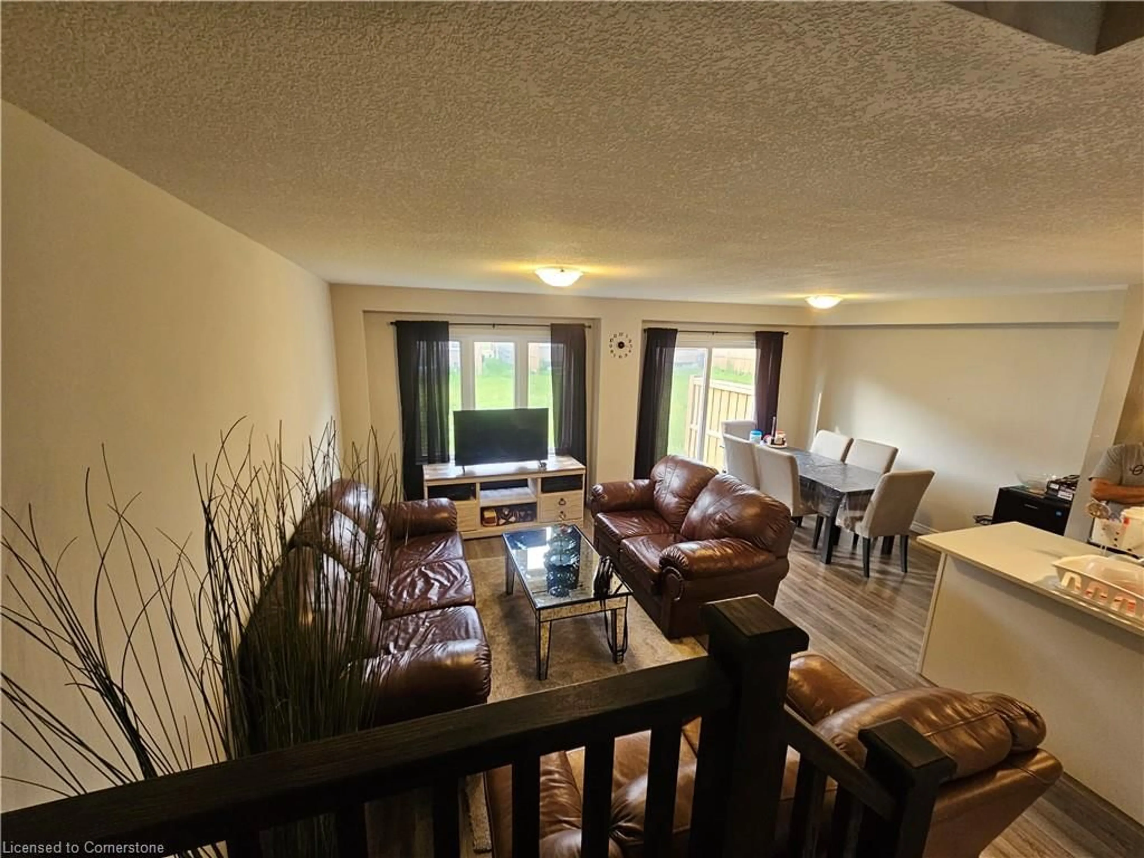 Living room with furniture, wood/laminate floor for 37 Munch Ave, Cambridge Ontario N1S 2A6