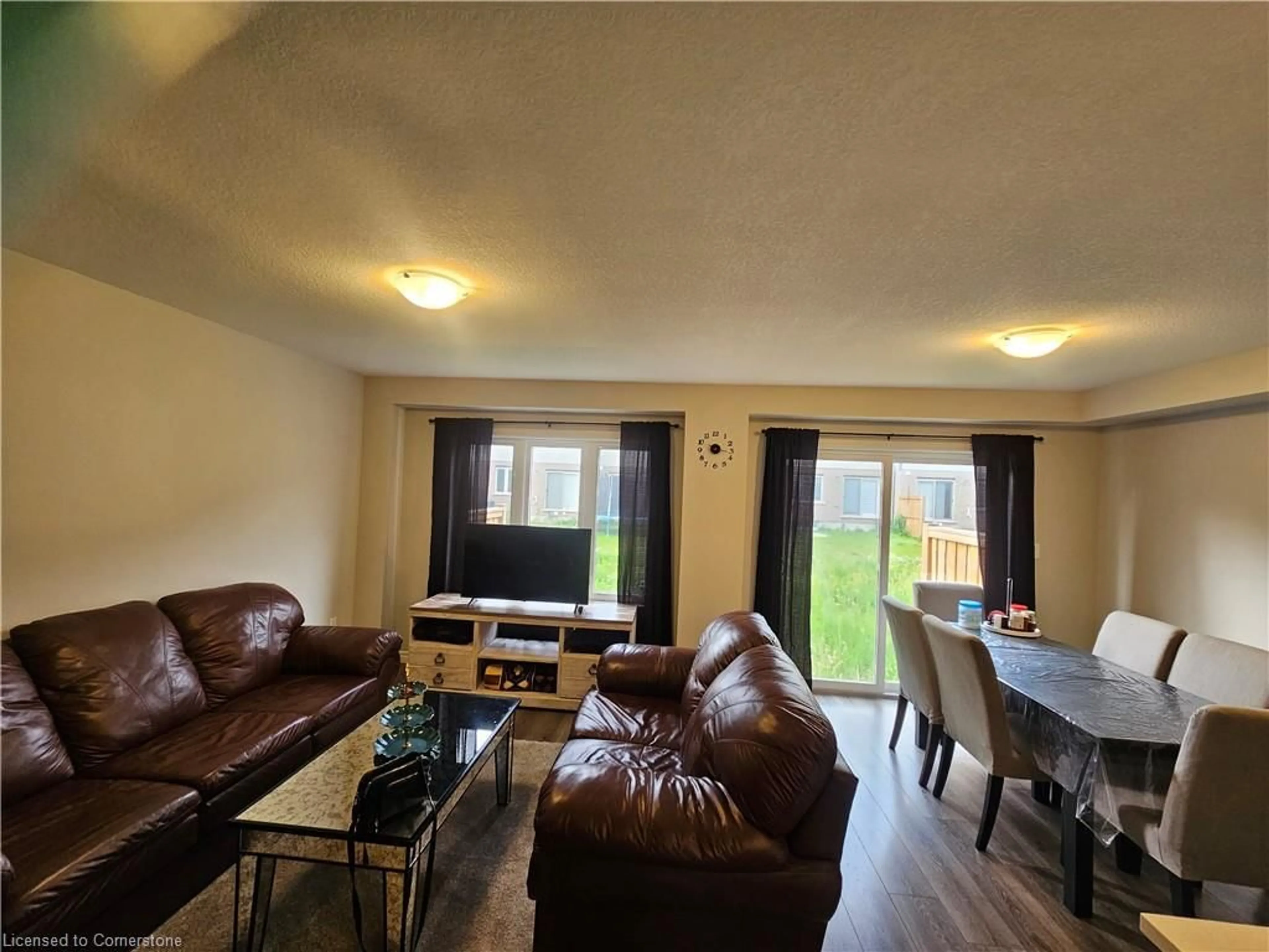 Living room with furniture, wood/laminate floor for 37 Munch Ave, Cambridge Ontario N1S 2A6